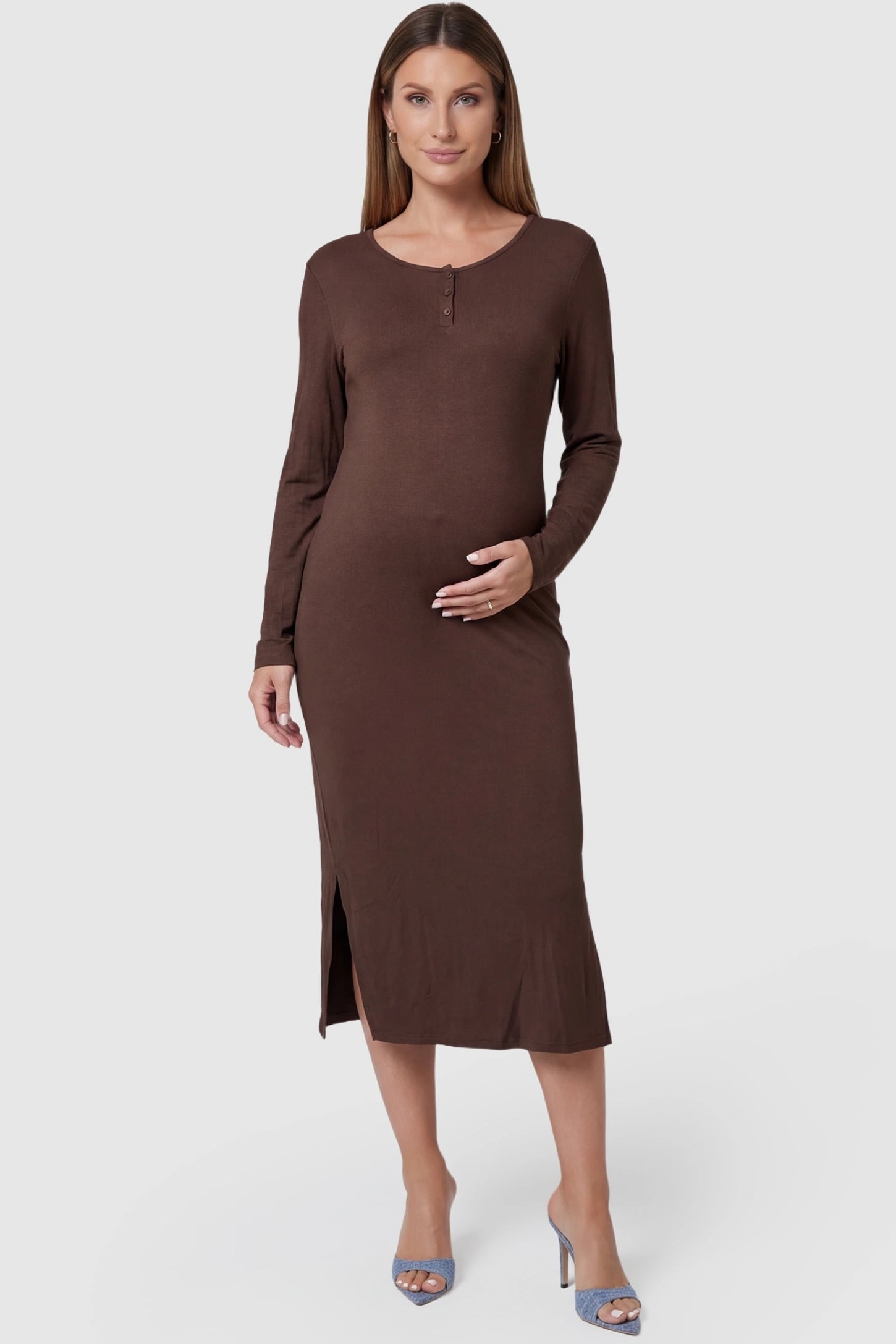 Scoop-neck button chest long-sleeve midi maternity dress in dark brown with button chest detailing, front view on pregnant model