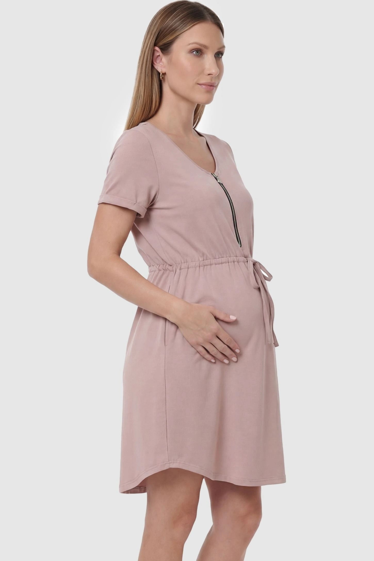 Scoop neck short sleeve maternity and nursing dress in rose gold featuring soft stretch fit in side view on a pregnant model