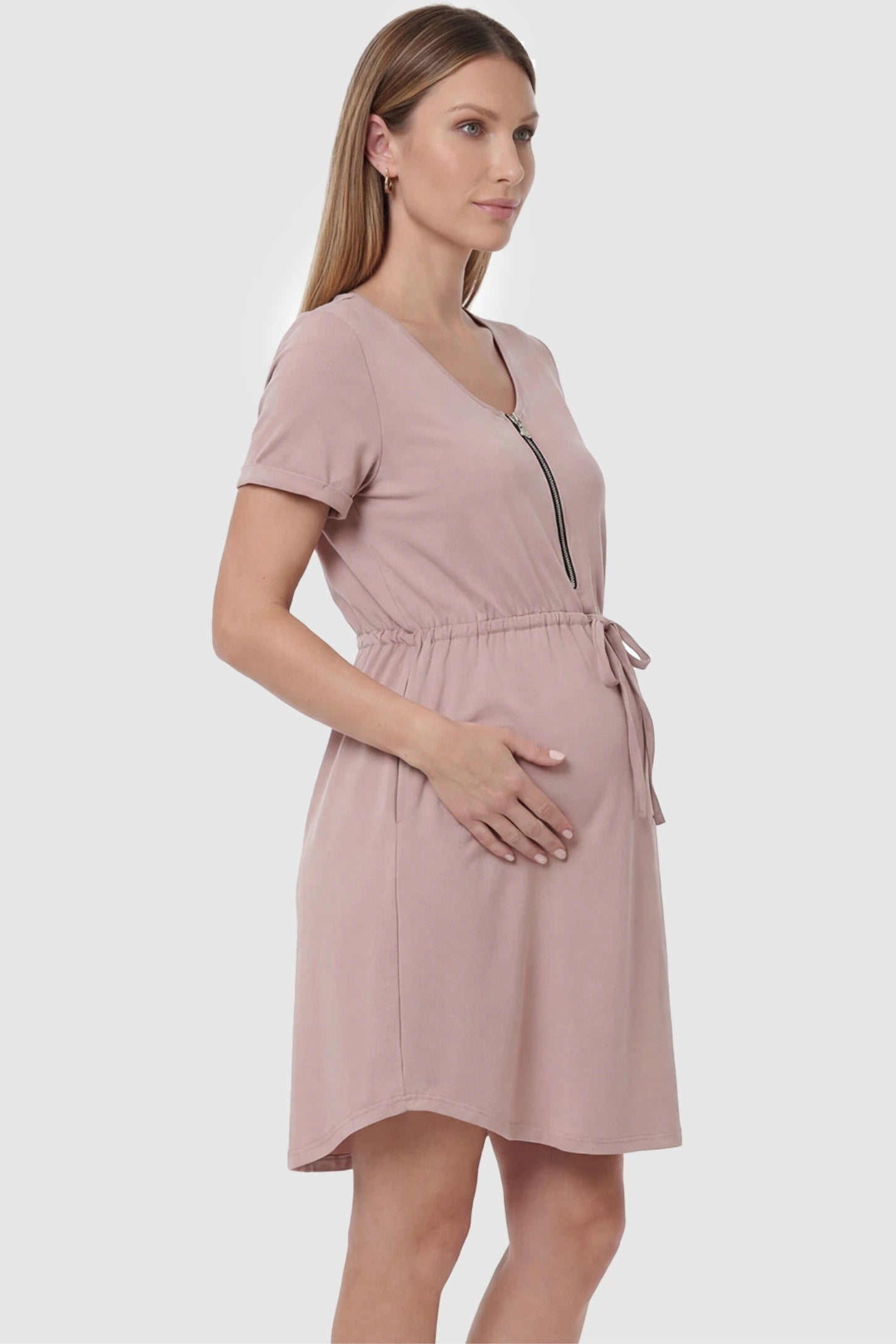 Scoop neck short sleeve maternity and nursing dress in rose gold featuring soft stretch fit in side view on a pregnant model