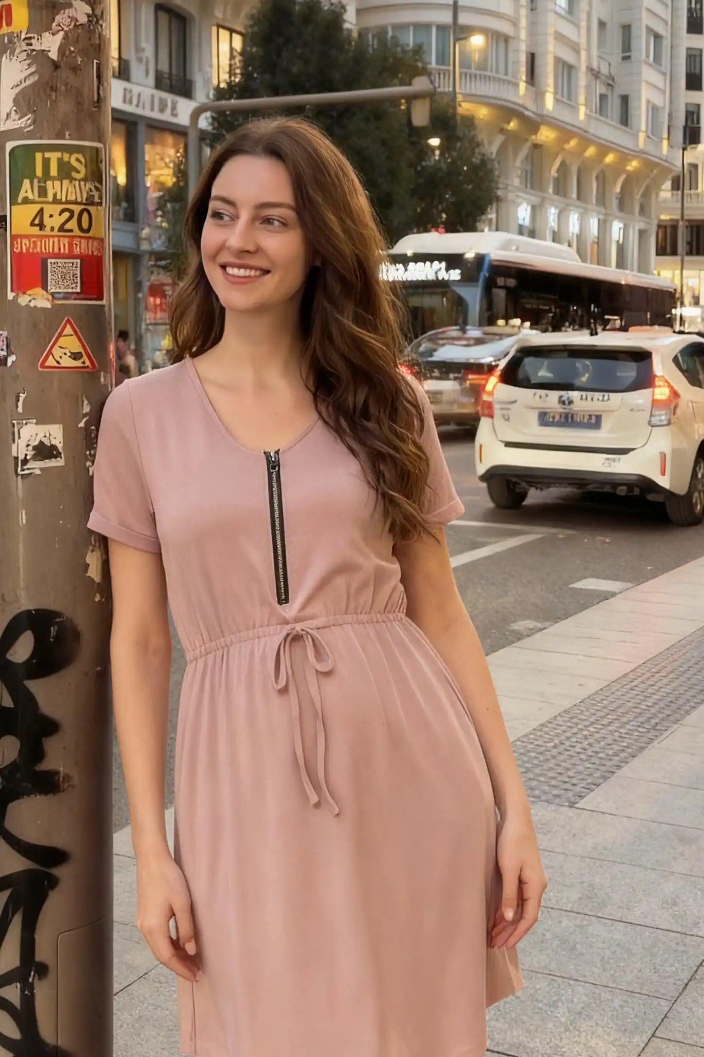 Scoop Neck Short Sleeve Maternity & Nursing Dress Scoop neck short sleeve maternity and nursing dress in rose gold featuring front zipper closure in front view on a styled lifestyle model