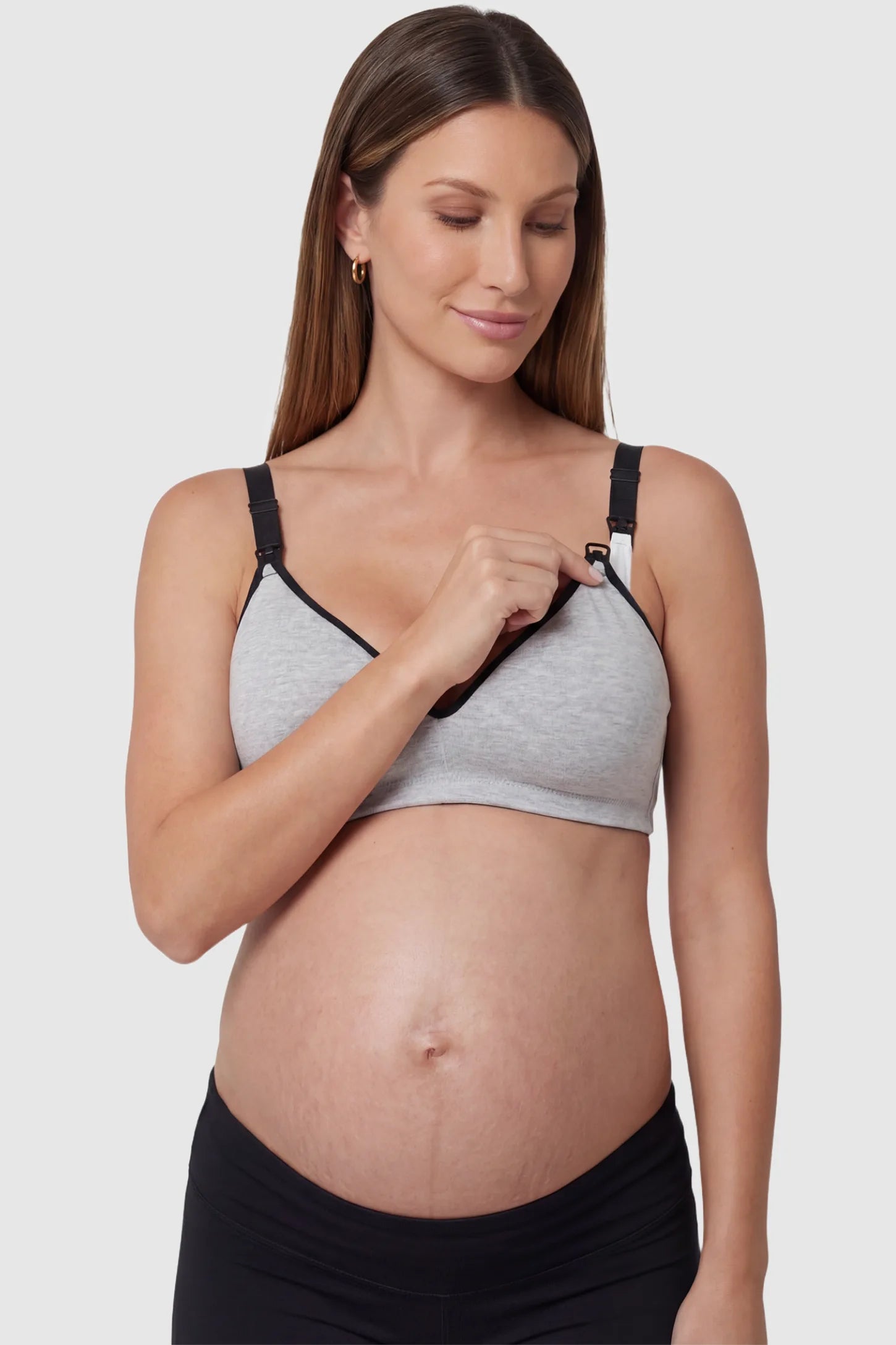 Clip-Down Seamless Nursing Bra Clip-Down Seamless Nursing Bra in gray featuring soft V-neck shape, full-cup coverage, and one-hand nursing clips on pregnant model.