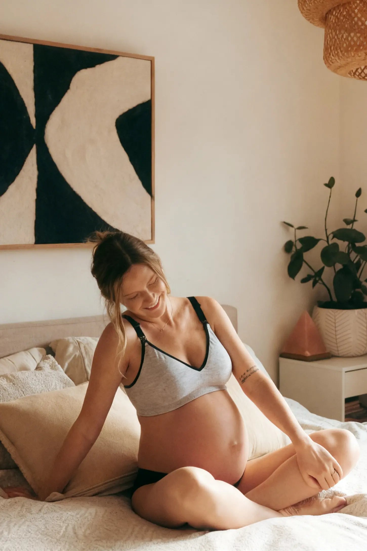 Clip-Down Seamless Nursing Bra Clip-Down Seamless Nursing Bra in gray featuring soft V-neck shape, and full-cup coverage on pregnant model.