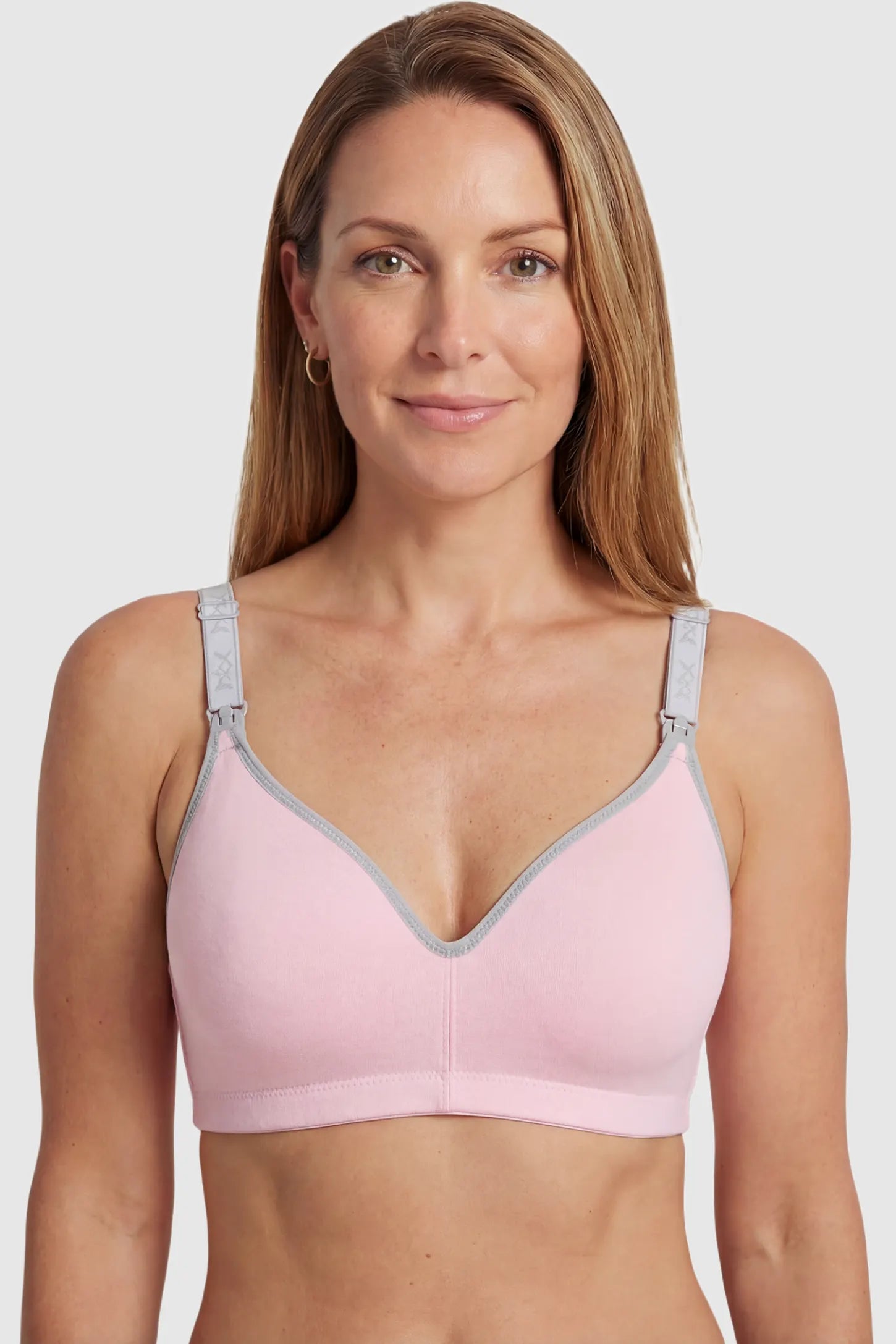 Clip-Down Seamless Nursing Bra Clip-Down Seamless Nursing Bra in pink featuring soft V-neck shape, and full-cup coverage on non pregnant model.