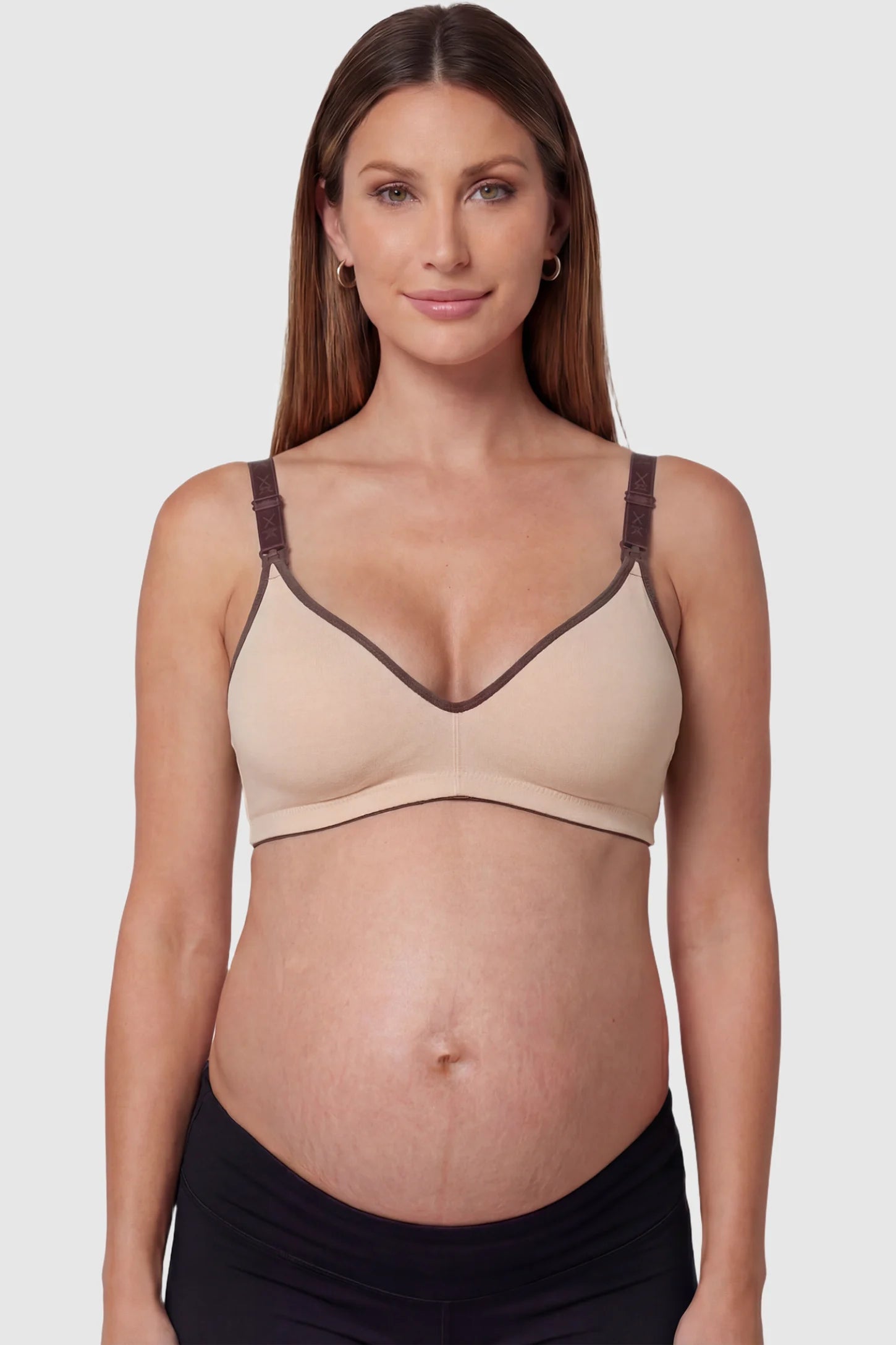 Clip-Down Seamless Nursing Bra Clip-Down Seamless Nursing Bra in skin tone featuring soft V-neck shape, and full-cup coverage on pregnant model.