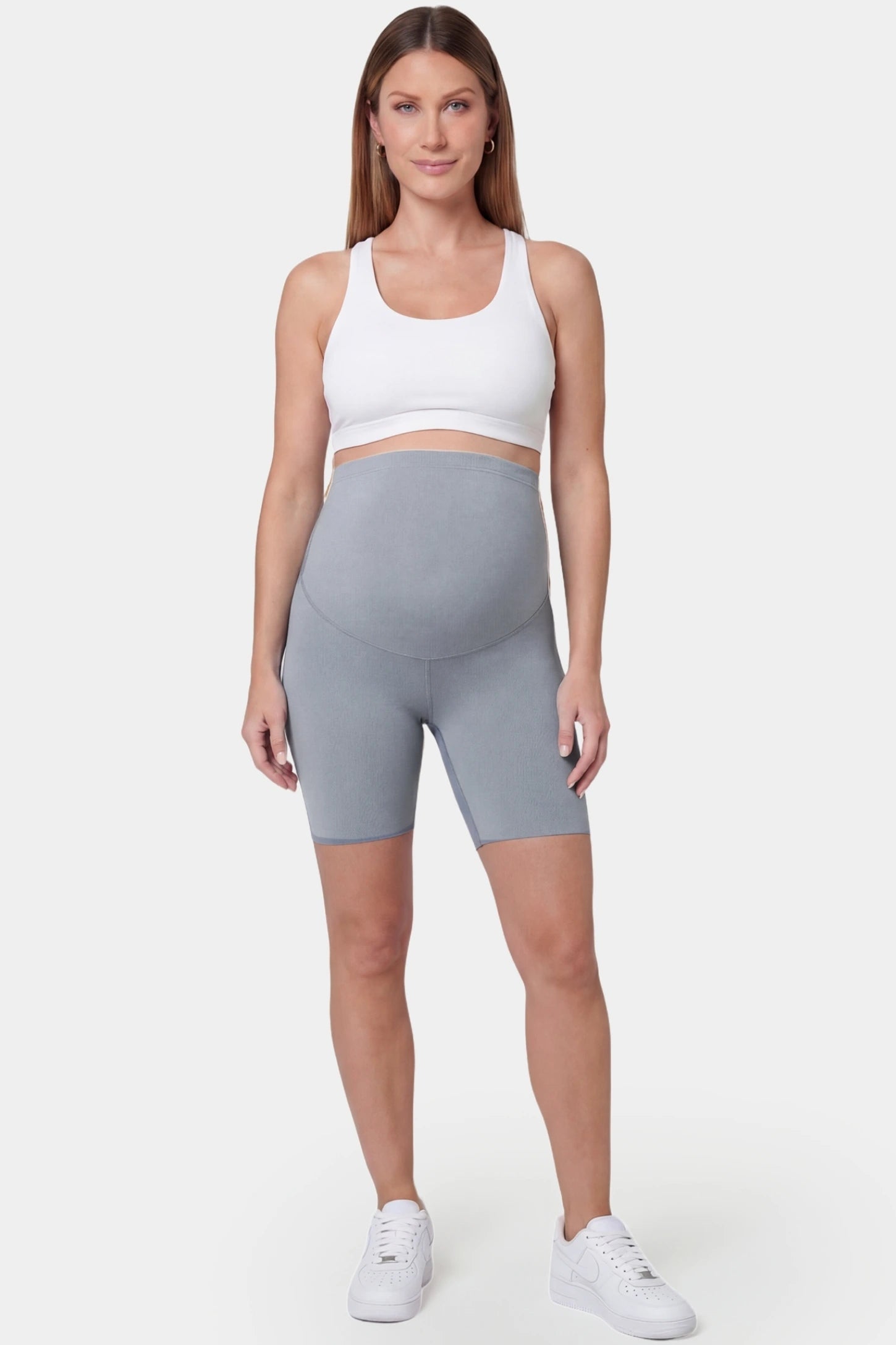 Seamless belly support mid-thigh shaping maternity shorts in gray with sculpting fit, full body on pregnant model