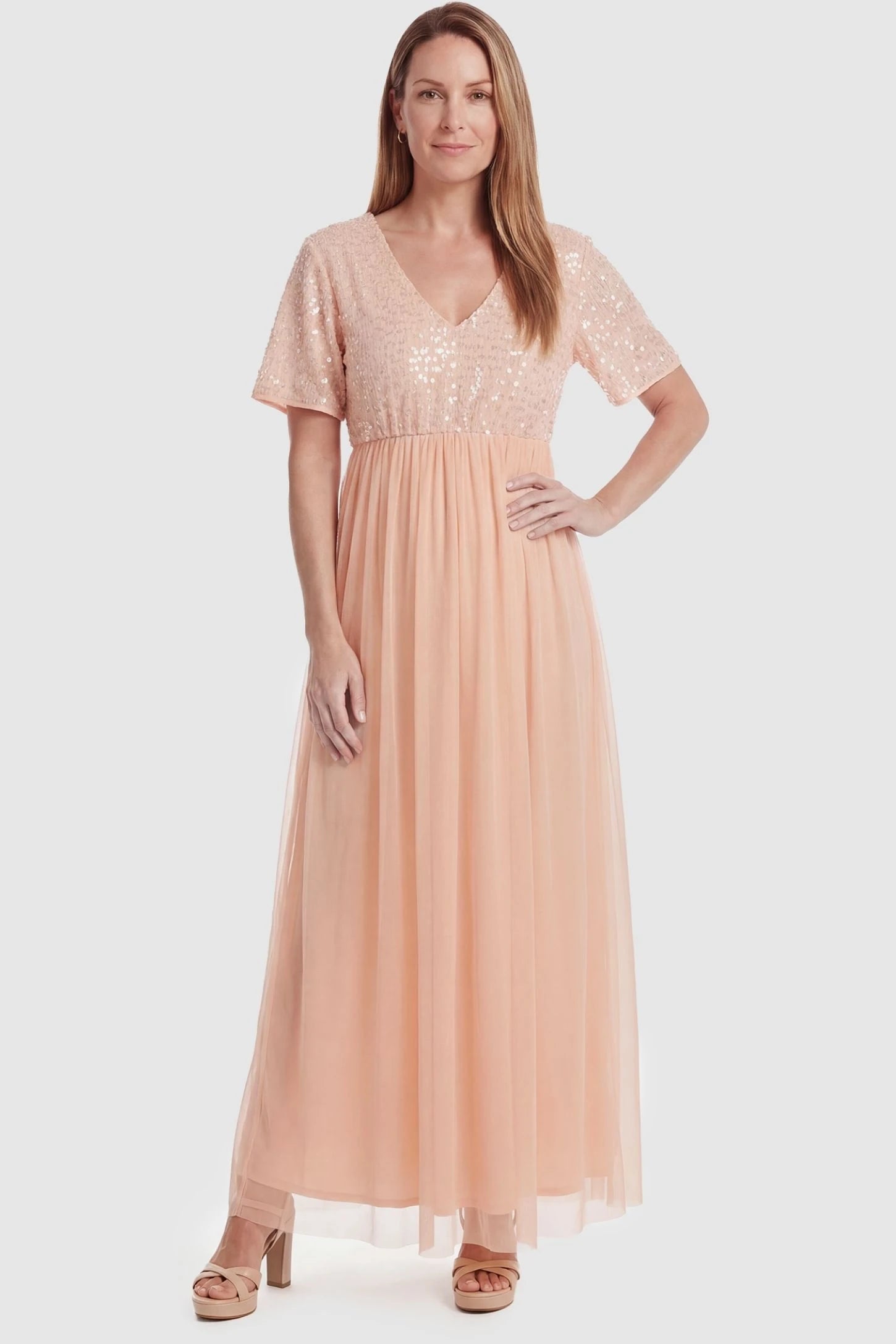 Sequin Ruffle Sleeve Maternity Dress Sequin Ruffle Sleeve Maternity Photoshoot Dress in Pink featuring a V-neckline on a non-pregnant model, front view.