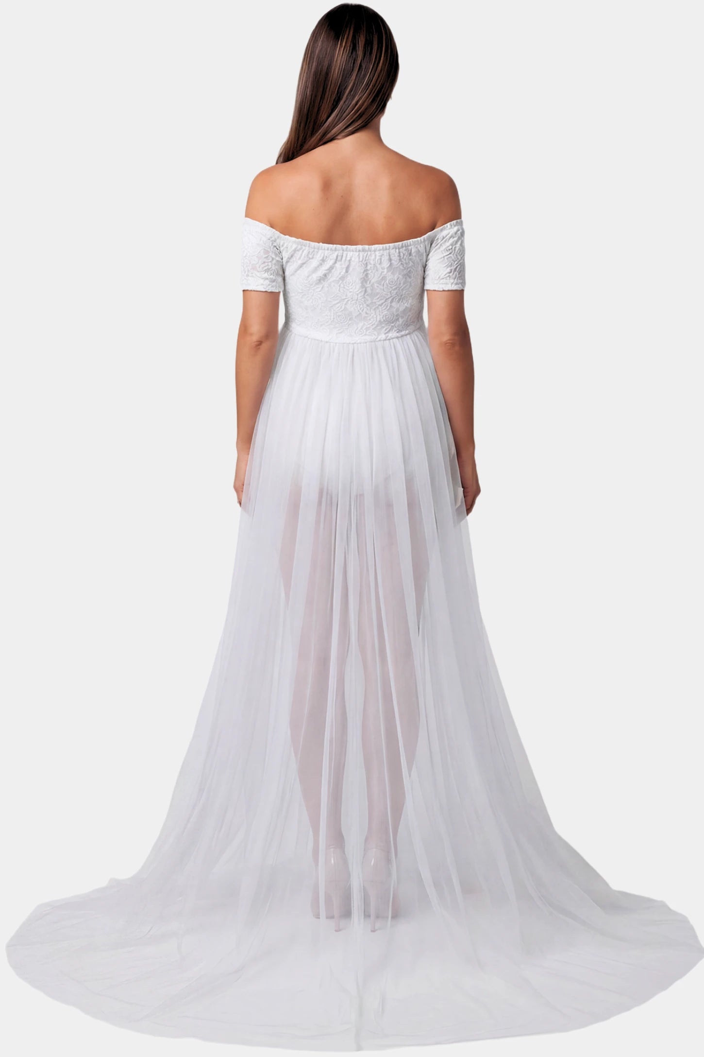 Lace Sheer Overlay Off-Shoulder Maternity Photoshoot Gown Lace Sheer Overlay Off Shoulder Maternity Photoshoot Gown in white featuring off shoulder design and flowing sheer skirt on a pregnant model.