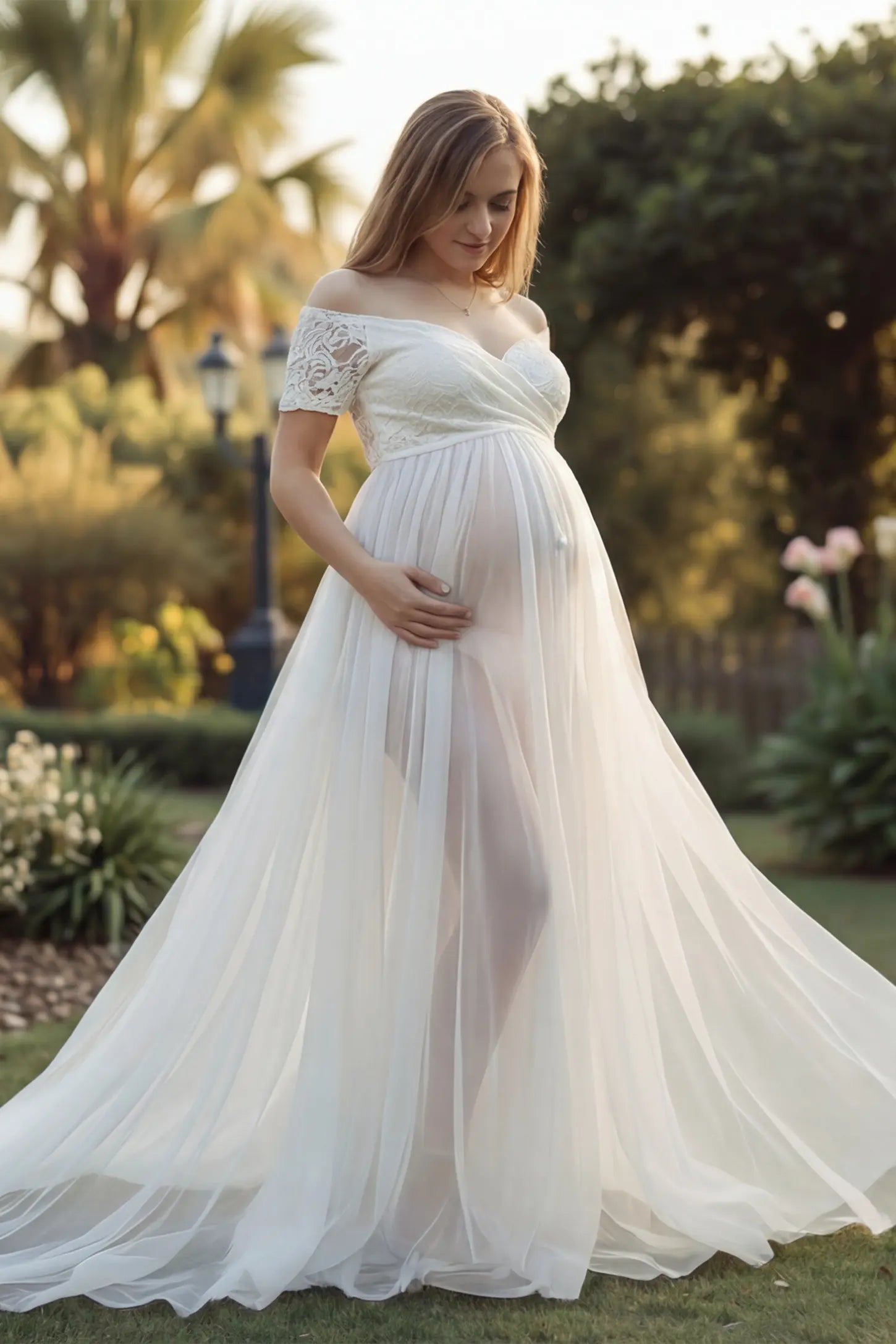 Lace Sheer Overlay Off-Shoulder Maternity Photoshoot Gown Lace Sheer Overlay Off Shoulder Maternity Photoshoot Gown in white featuring sweetheart neckline and flowing sheer skirt on a pregnant model.