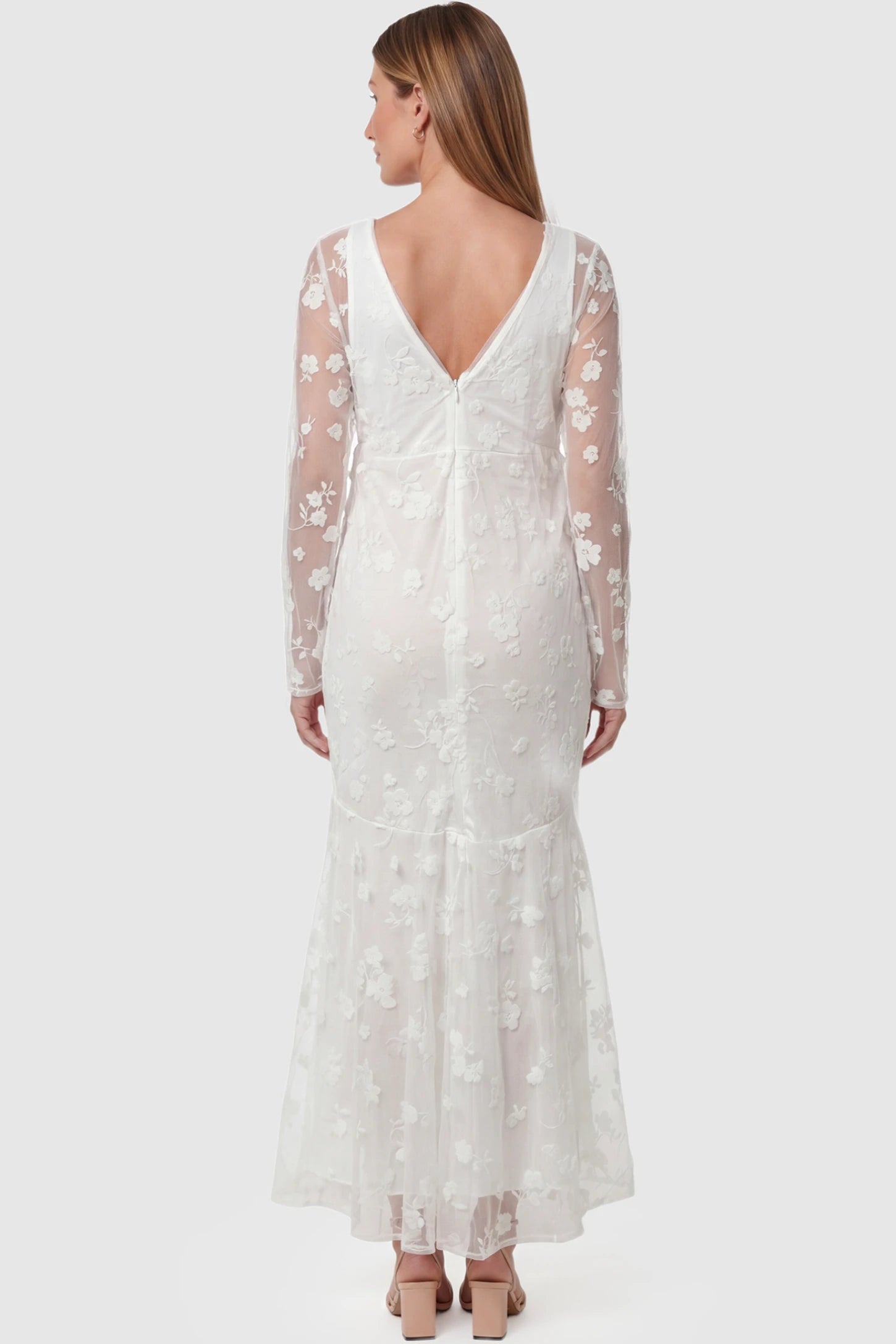 Lace Long Sheer Sleeve Bridal Maternity Gown Lace Long Sheer Sleeve Bridal Maternity Gown in white featuring floral embroidery and long sheer sleeves on a pregnant model back view