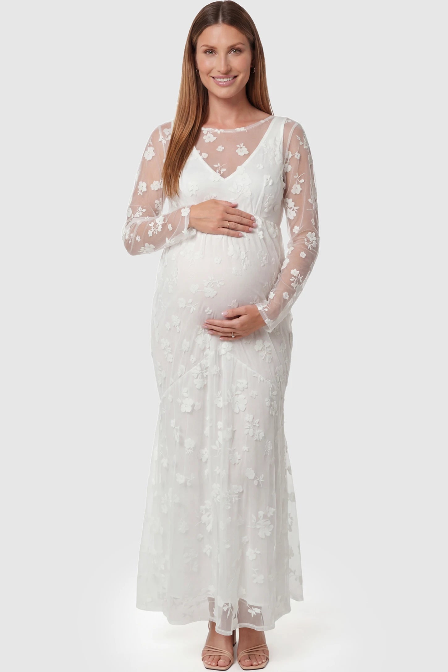 Lace Long Sheer Sleeve Bridal Maternity Gown in white featuring floral embroidery and long sheer sleeves on a pregnant model front view.