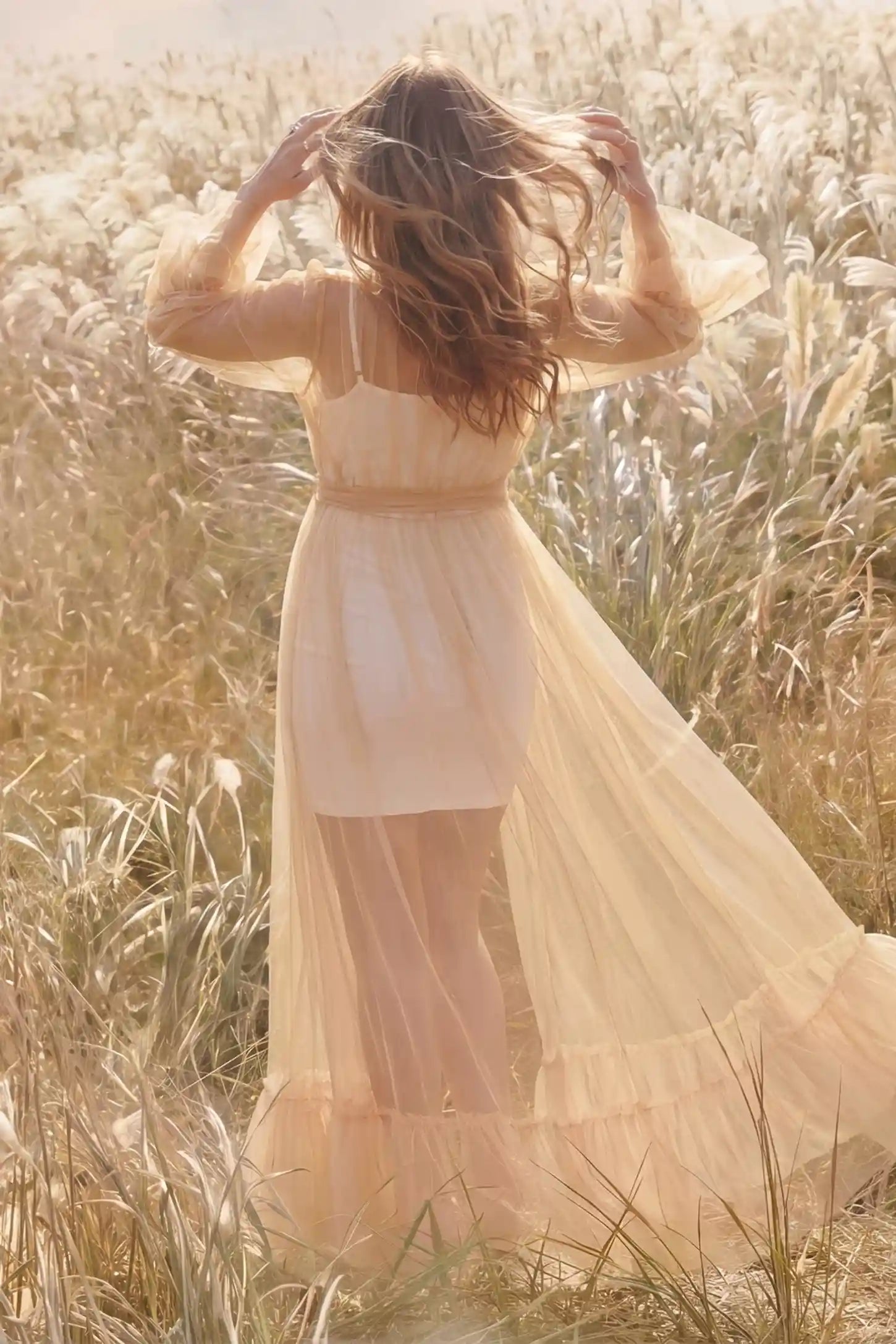 Sheer Tulle Deep V-Neck Tiered Maternity Maxi Gown Sheer tulle deep V-neck tiered maternity maxi gown in Camel with cascading sheer tulle layers, back view on pregnant model