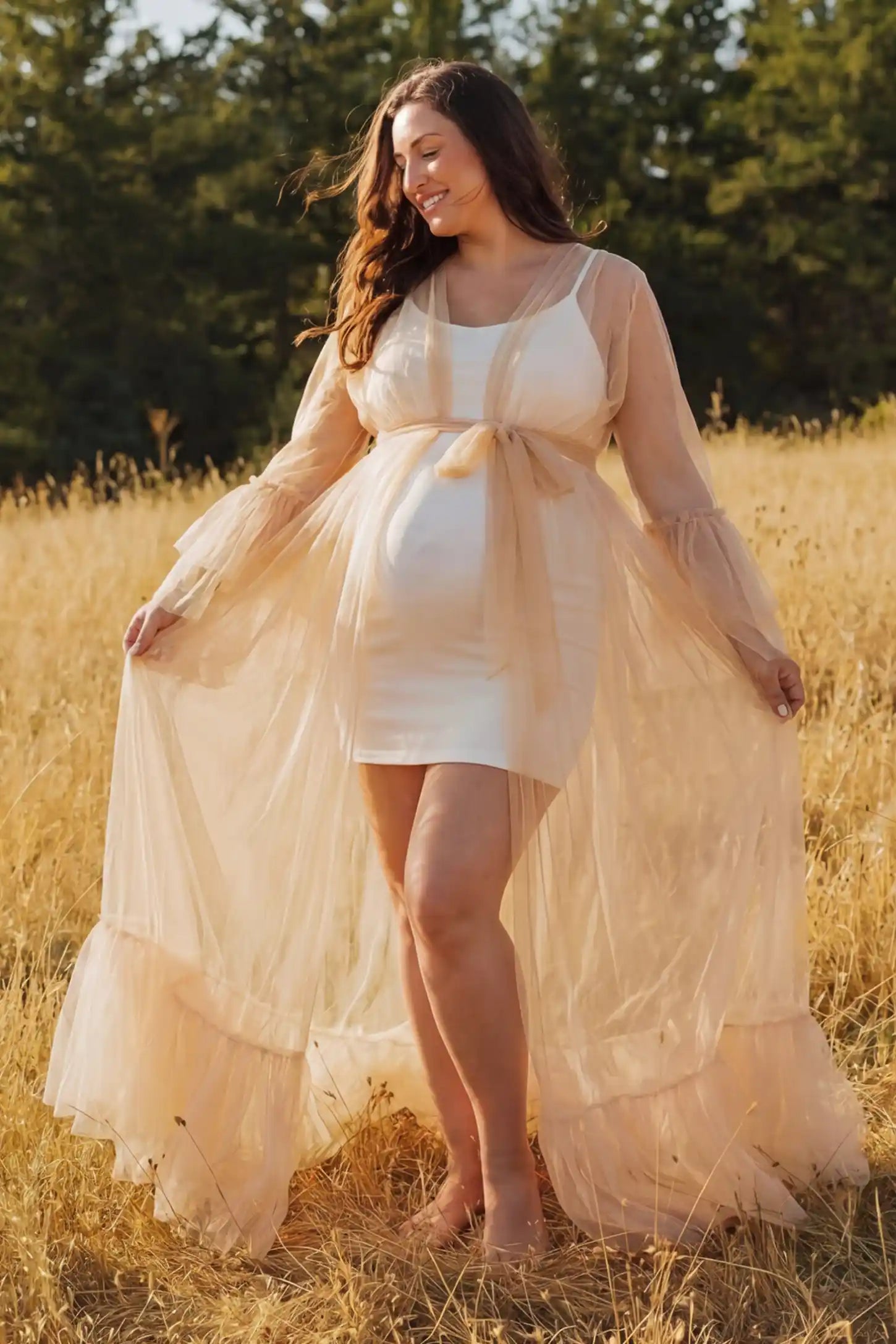 Sheer Tulle Deep V-Neck Tiered Maternity Maxi Gown Sheer tulle deep V-neck tiered maternity maxi gown in Camel with dramatic ethereal silhouette, side view on plus-size model