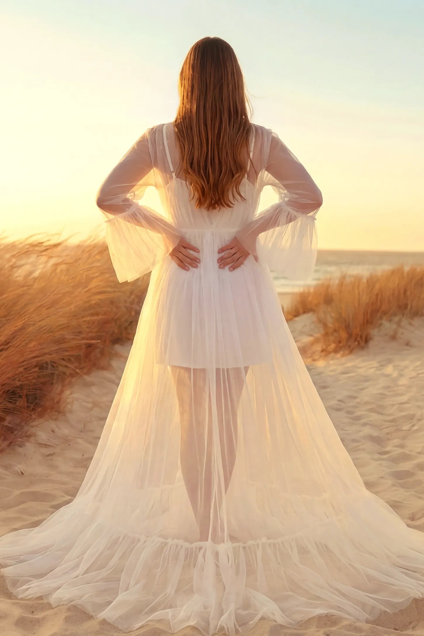 Sheer Tulle Deep V-Neck Tiered Maternity Maxi Gown Sheer tulle deep V-neck tiered maternity maxi gown in white with cascading sheer tulle layers, back view on pregnant model