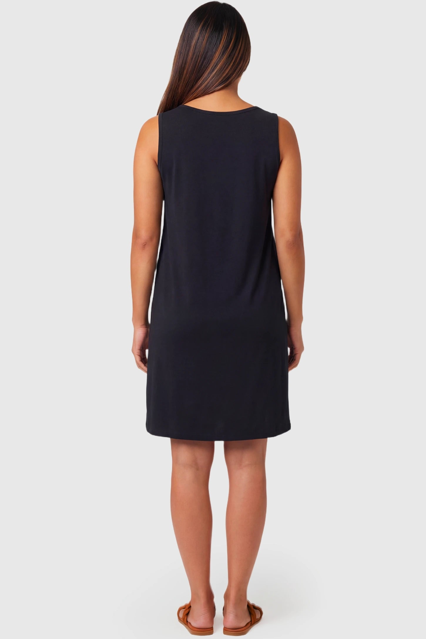Sleeveless Shift Maternity & Nursing Short Dress Sleeveless Shift Maternity & Nursing Short Dress in black featuring a relaxed shift silhouette on a pregnant model.