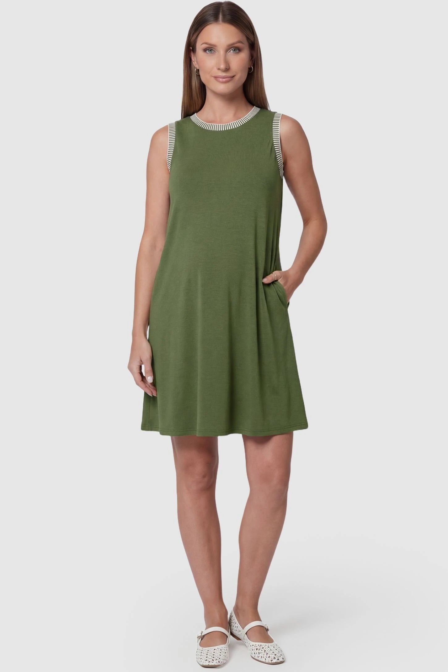 Sleeveless round neck A-line short maternity dress in army green featuring sleeveless and flattering A-line cut in front view on a pregnant model