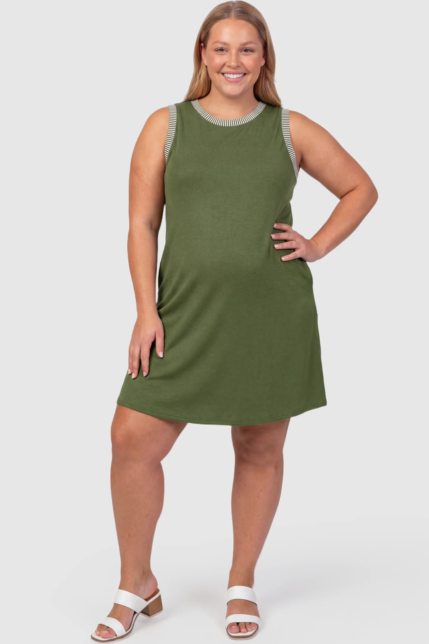 Sleeveless A-Line Maternity Mini Dress Sleeveless A-Line Maternity Short Dress in army green featuring sleeveless cut in front view on a plus-size model