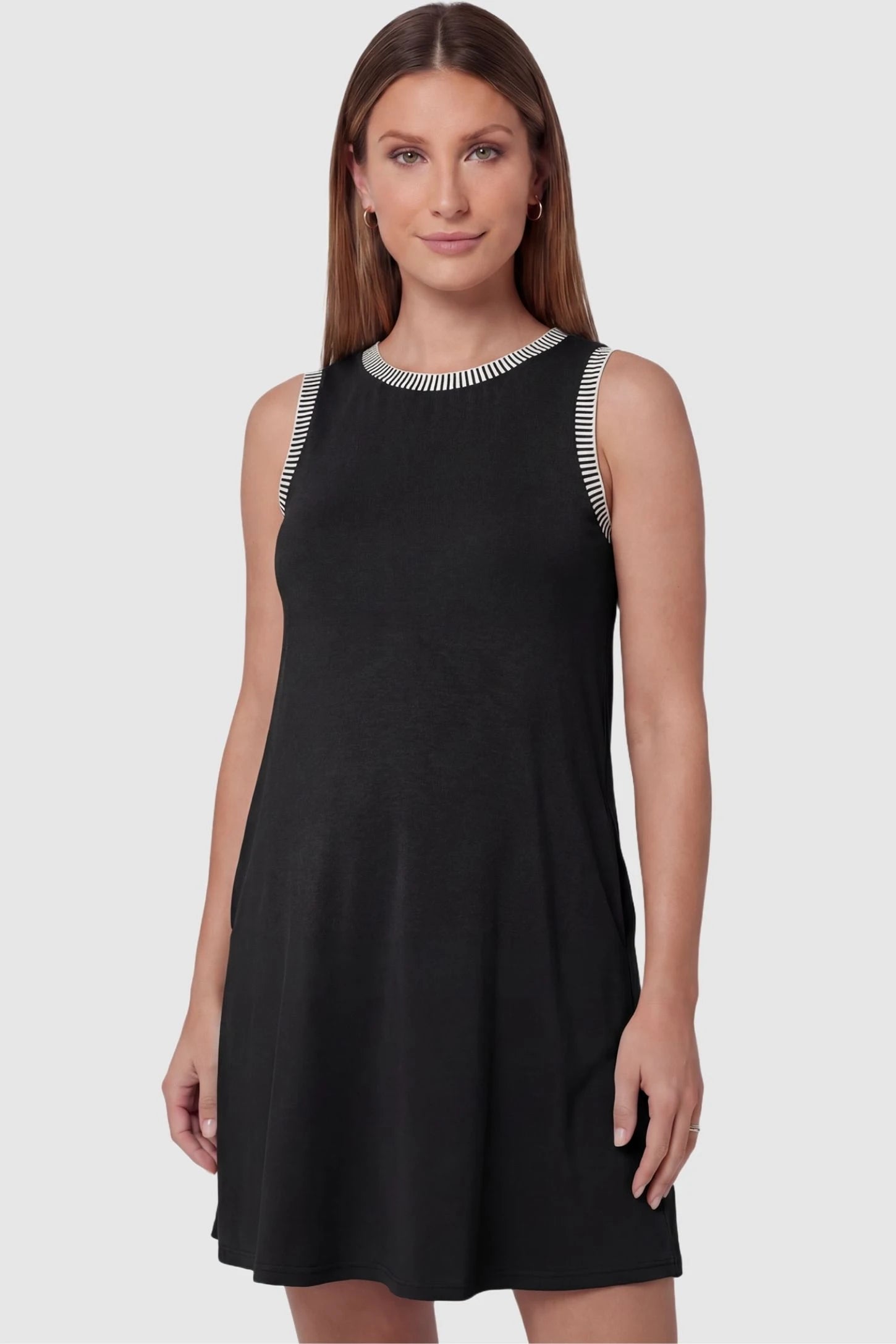 Sleeveless Round Neck A-Line Short Maternity Dress Sleeveless round neck A-line short maternity dress in black featuring sleeveless and flattering A-line cut in front view on a pregnant model