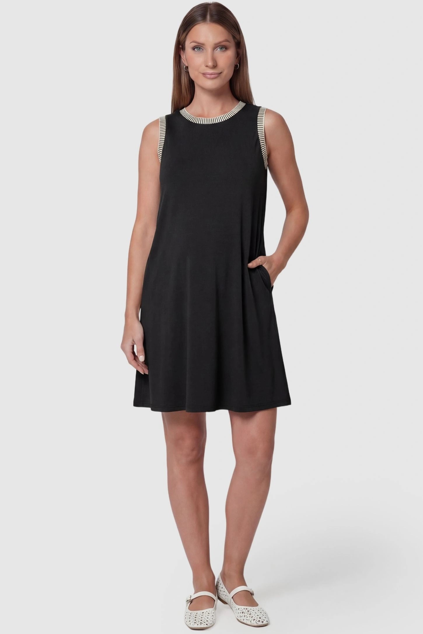 Sleeveless Round Neck A-Line Short Maternity Dress Sleeveless round neck A-line short maternity dress in black featuring sleeveless and flattering A-line cut in front view on a pregnant model