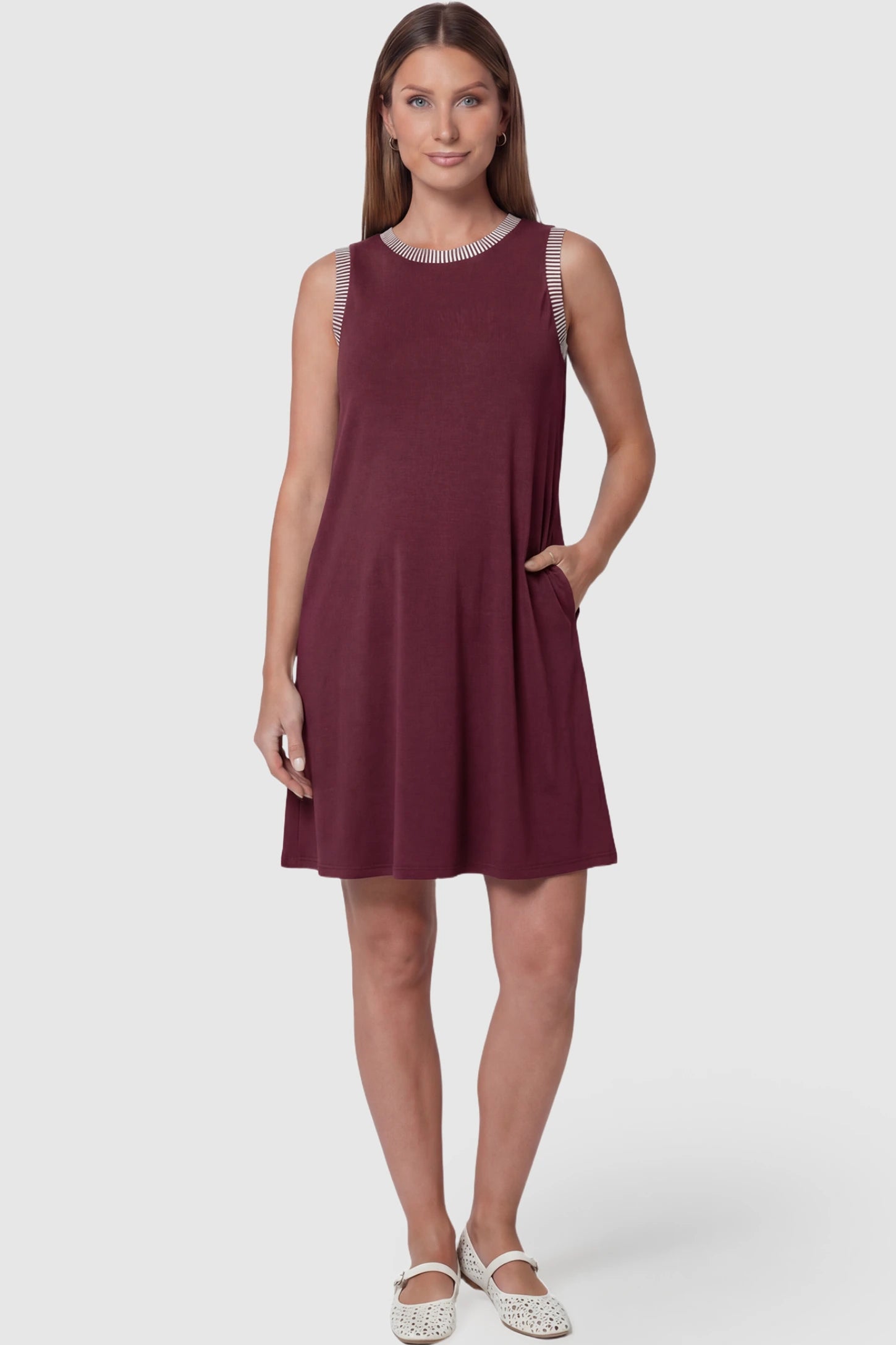 Sleeveless A-Line Maternity Mini Dress Sleeveless A-Line Maternity Short Dress in burgundy featuring sleeveless cut in front view on a pregnant model