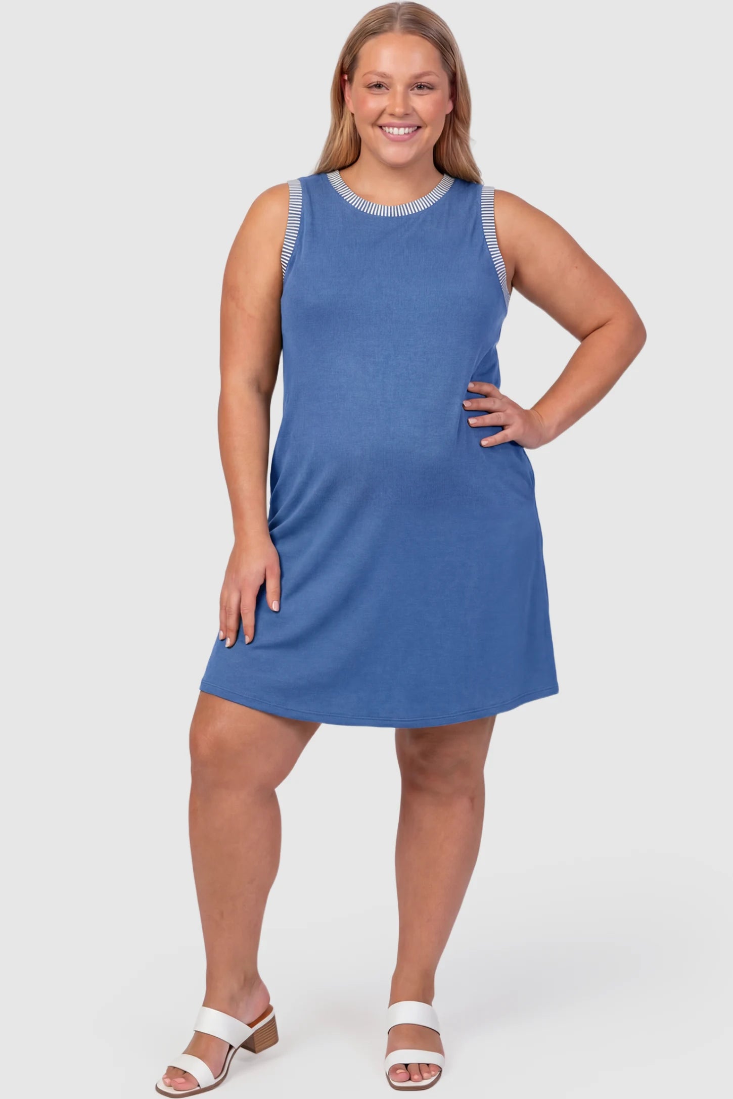Sleeveless A-Line Maternity Mini Dress Sleeveless A-Line Maternity Short Dress in royal blue featuring sleeveless cut in front view on a plus-size model