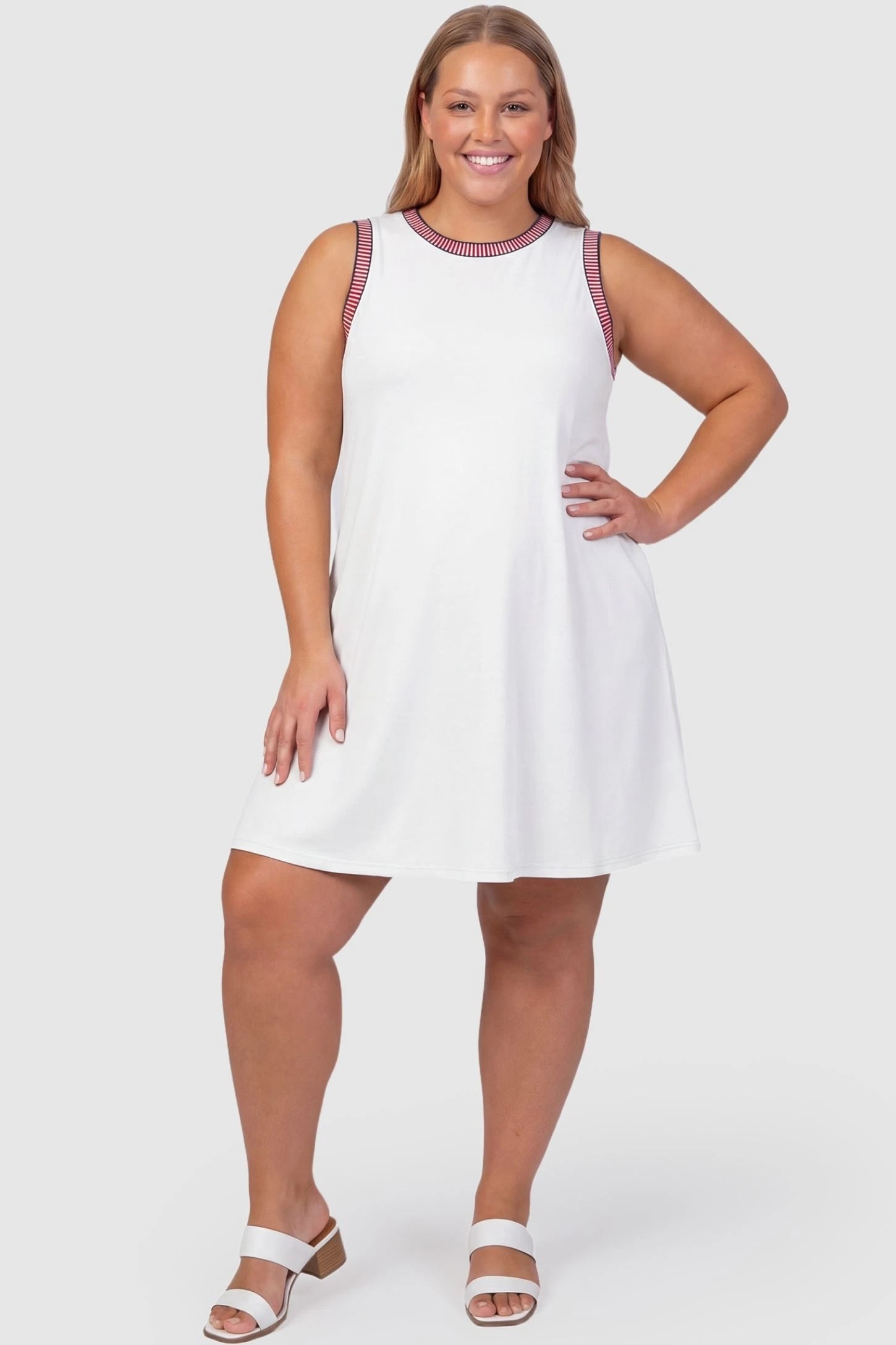 Sleeveless Round Neck A-Line Short Maternity Dress Sleeveless round neck A-line short maternity dress in white featuring umbrella skirt silhouette in full body view on a plus-size model