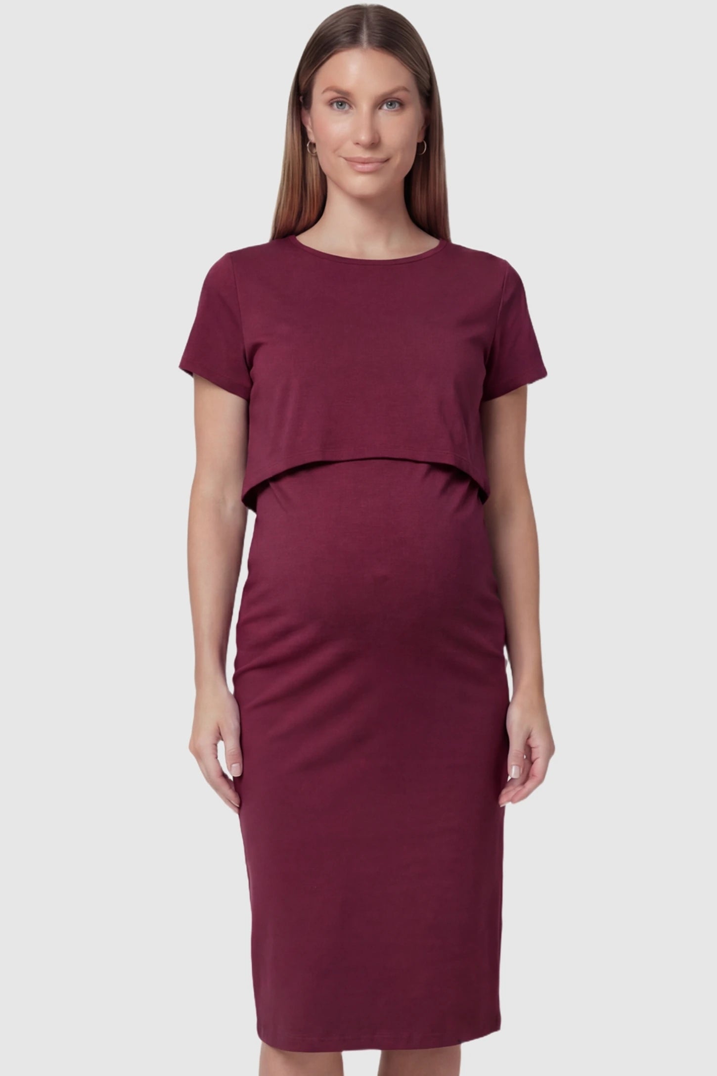 Short Sleeve Layered Midi Maternity Nursing Dress in Burgundy featuring a pencil cut on a pregnant model.