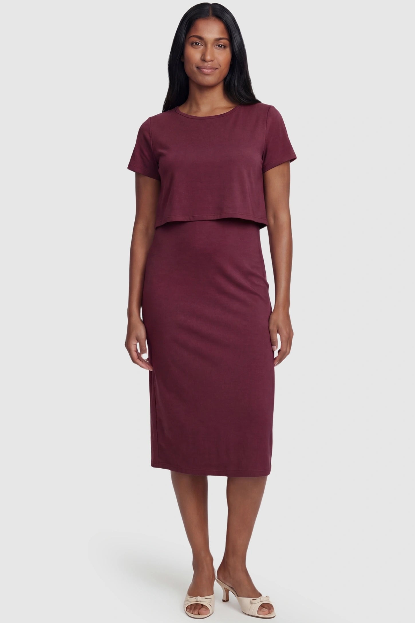 Short Sleeve Layered Midi Maternity Nursing Dress Short Sleeve Layered Midi Maternity Nursing Dress in Burgundy featuring a discreet breastfeeding opening on a postpartum model.