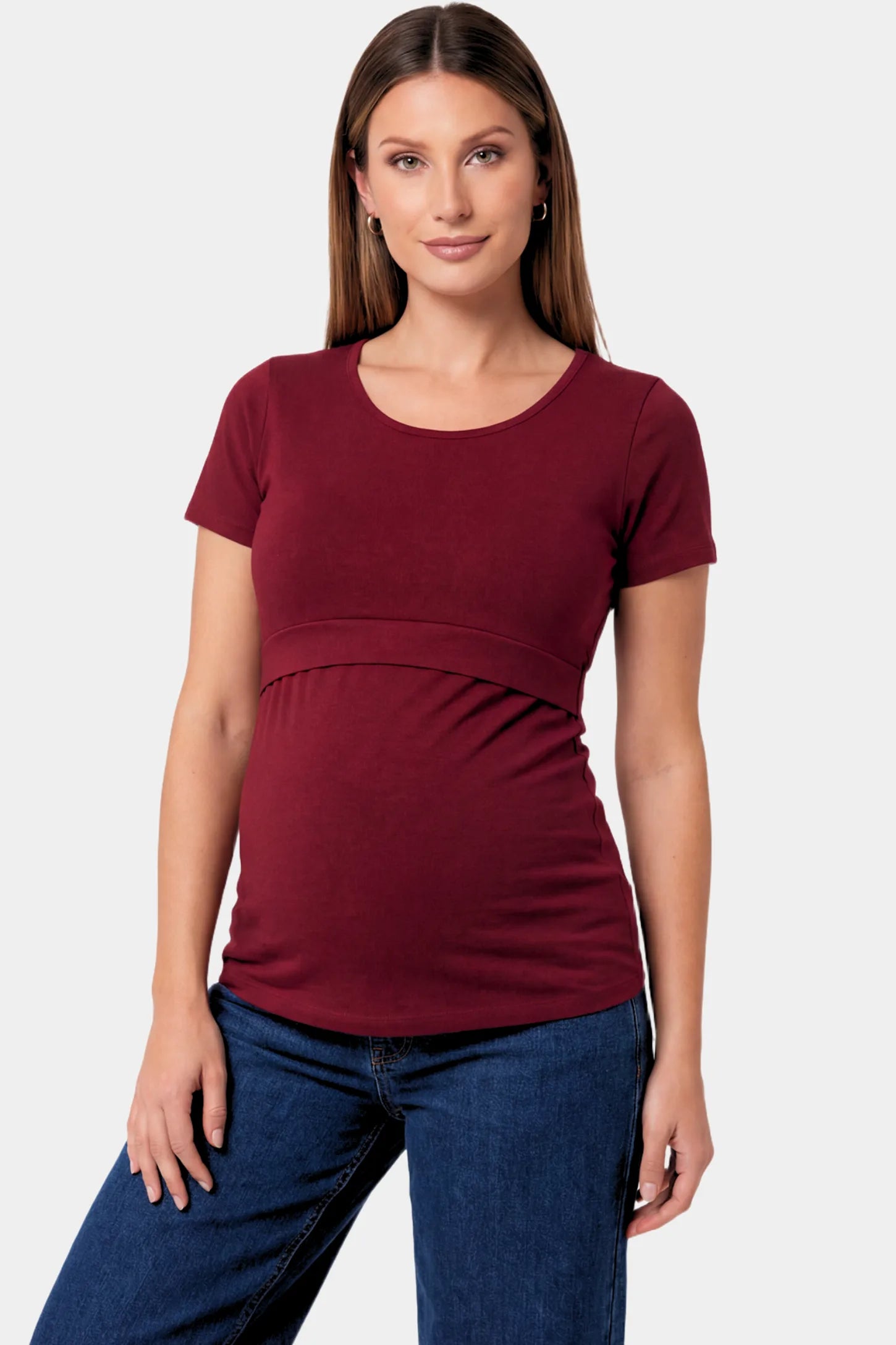 Basic Crew Neck Maternity & Nursing T-Shirt Basic Crew Neck Maternity & Nursing T-Shirt in burgundy featuring a stretch-fit round neck design on a pregnant model.