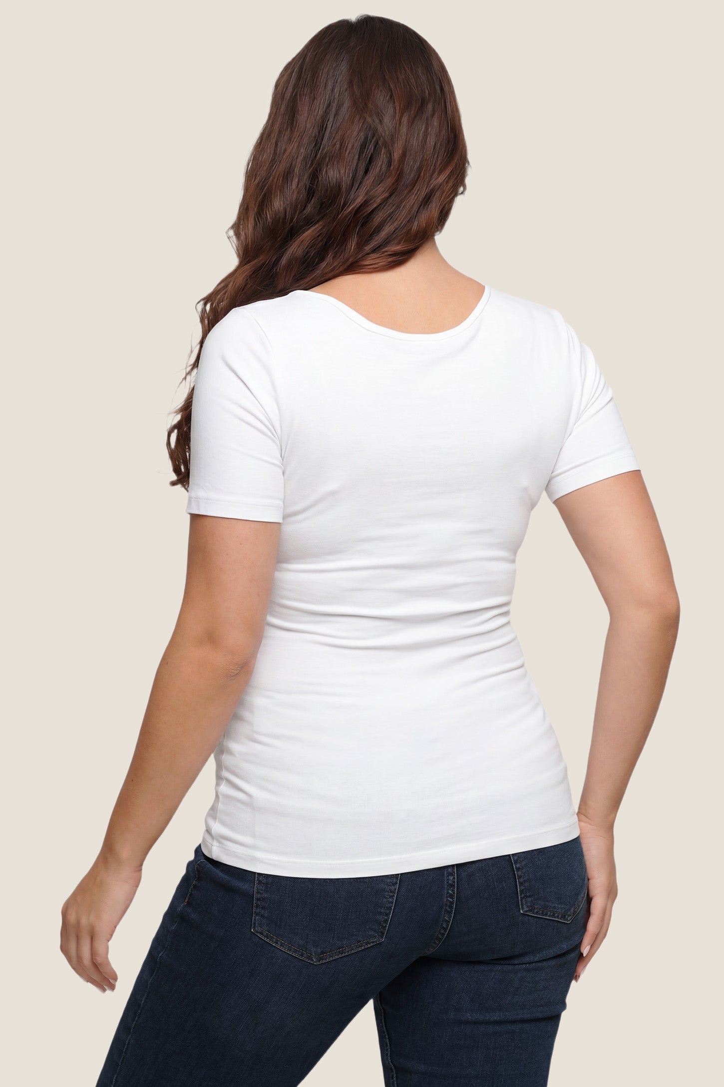 Basic Crew Neck Maternity & Nursing T-Shirt Basic Crew Neck Maternity & Nursing T-Shirt in White featuring a stretch-fit round neck design on a pregnant model, back view.