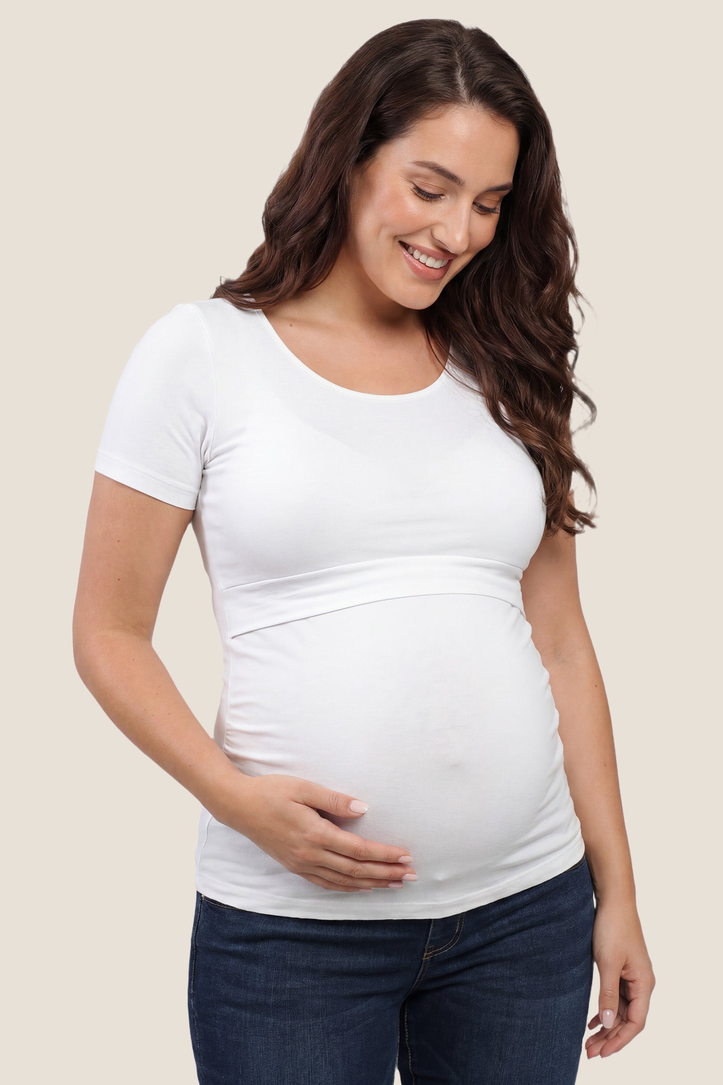 Basic Crew Neck Maternity & Nursing T-Shirt Basic Crew Neck Maternity & Nursing T-Shirt in White featuring a stretch-fit round neck design on a pregnant model, front view.