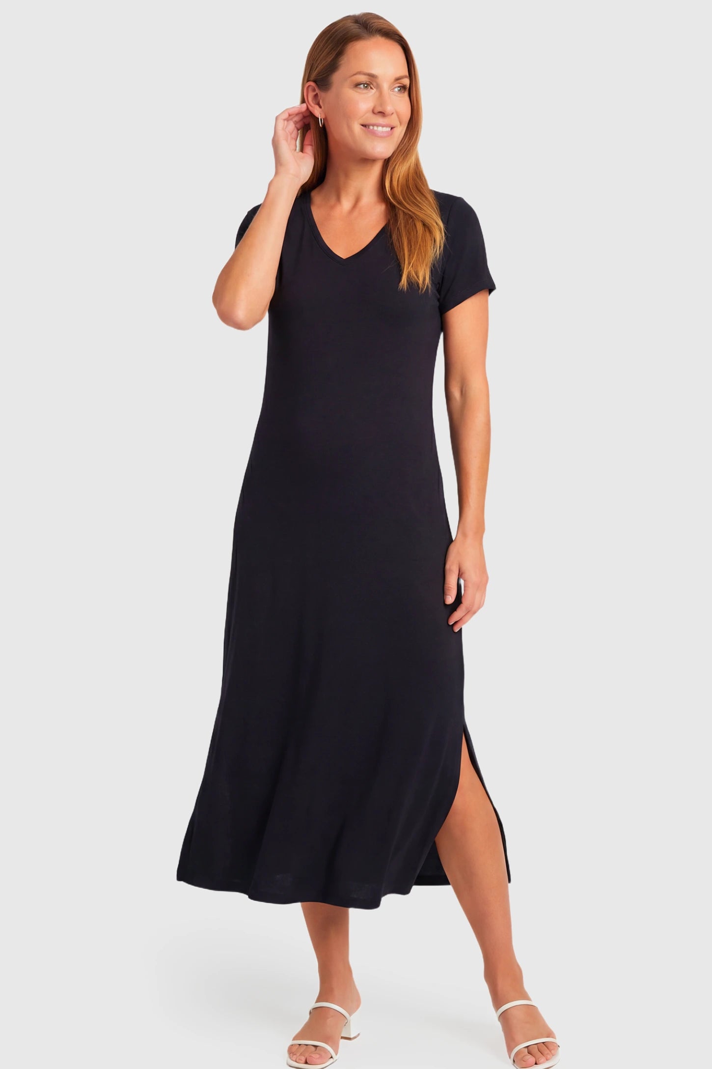 Casual V-Neck Short Sleeve Maternity Midi Dress Casual V-Neck Short Sleeve Maternity Midi Dress in black featuring a relaxed straight fit and side slit on a non pregnant model.