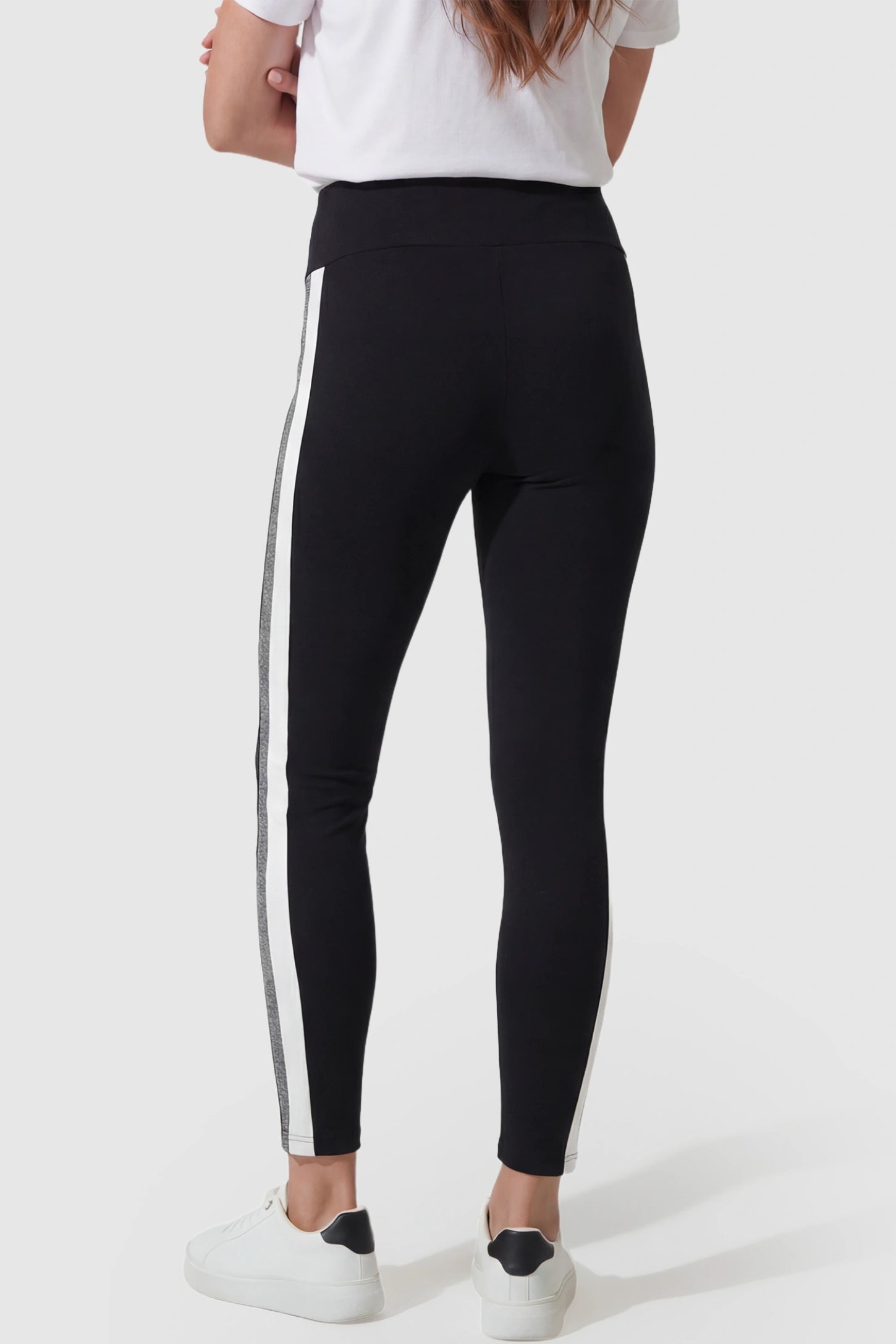 Stretch Waist Panel Side-Stripe Maternity Leggings Stretch waist panel side-stripe maternity leggings in black with sporty casual style, back view on pregnant model