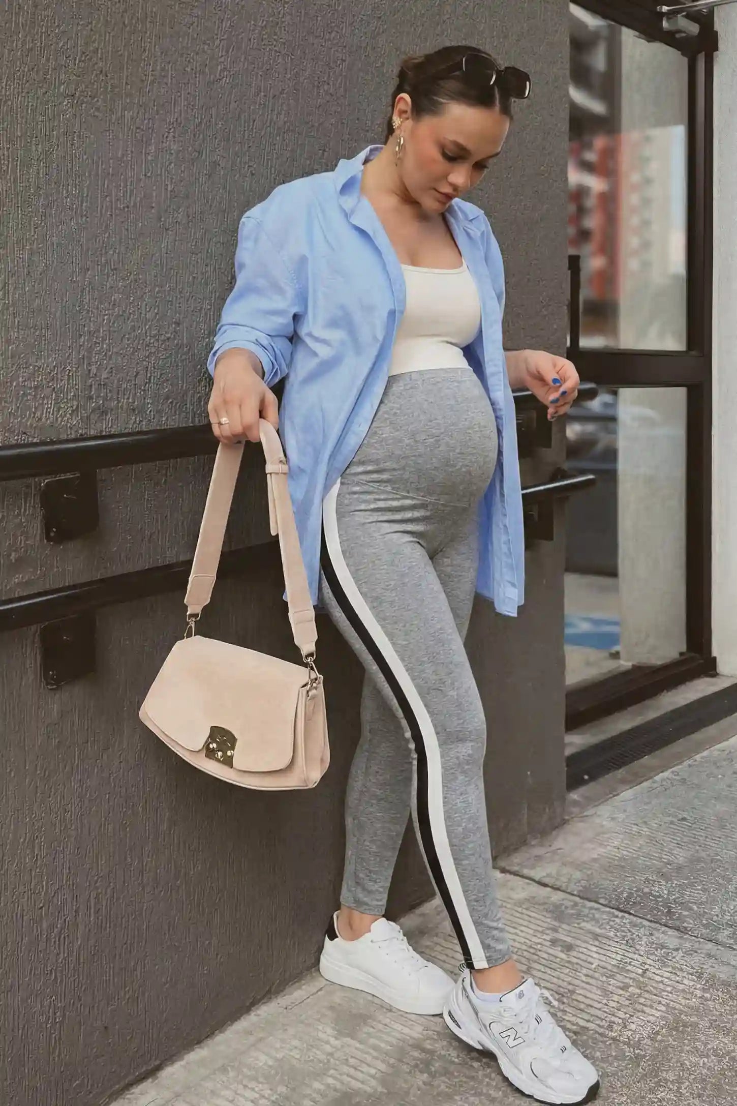 Stretch Waist Panel Side-Stripe Maternity Leggings Stretch waist panel side-stripe maternity leggings in gray with bold side stripe detail, side view on pregnant model