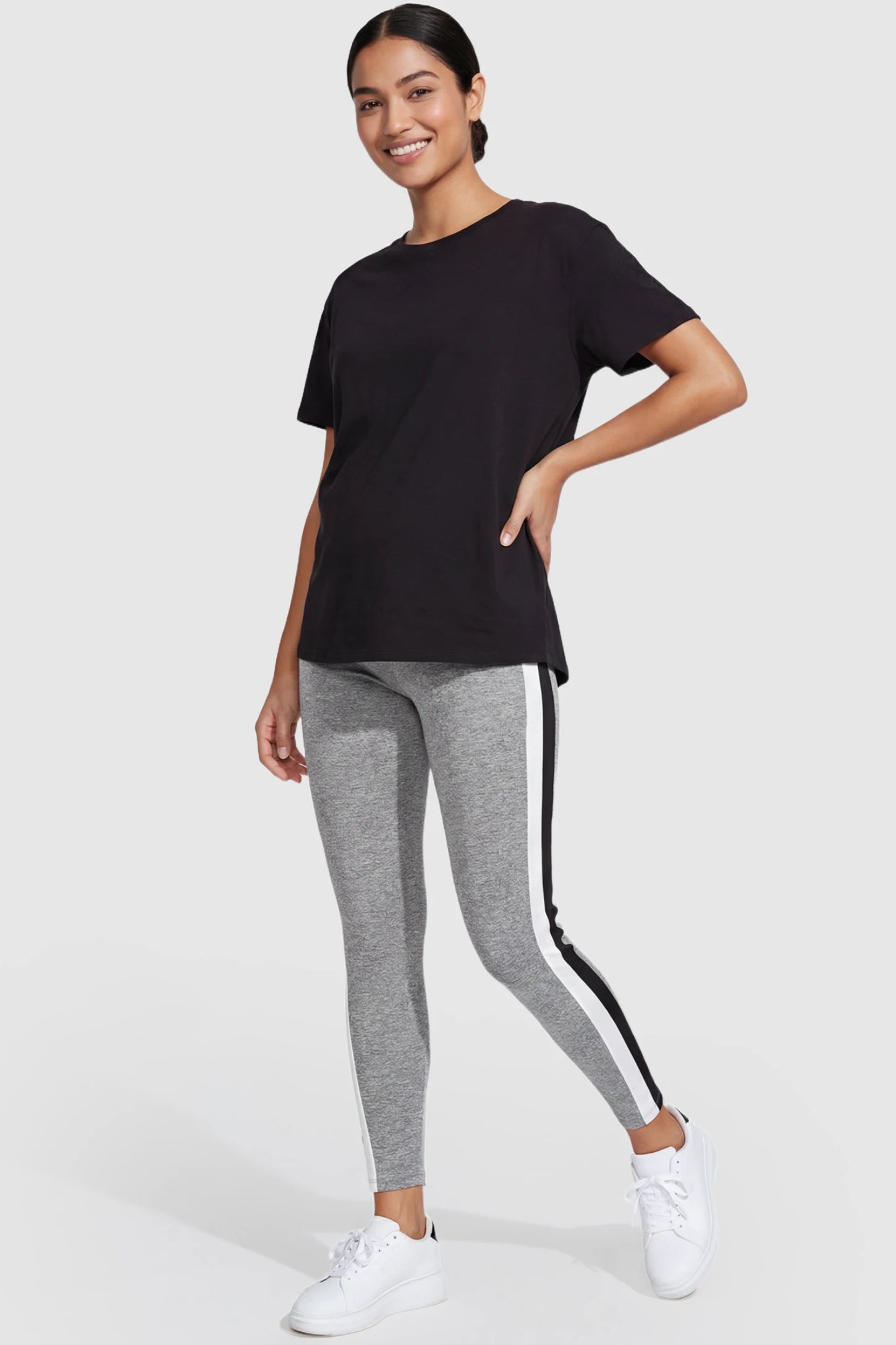 Stretch Waist Panel Side-Stripe Maternity Leggings Stretch waist panel side-stripe maternity leggings in gray with bold side stripe detail, front view on postpartum model