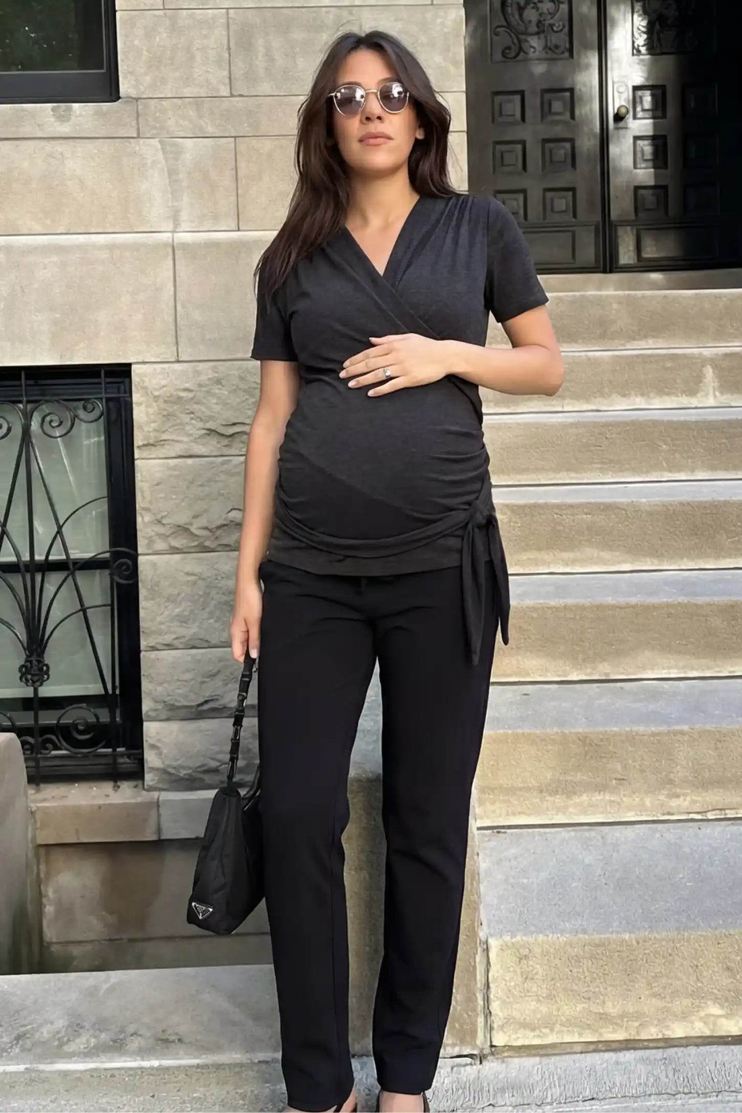 3 in 1 Skin to Skin Wrap Nursing Top Skin to Skin Wrap Nursing Top in black featuring soft wrap-front design and short sleeves on pregnant model.