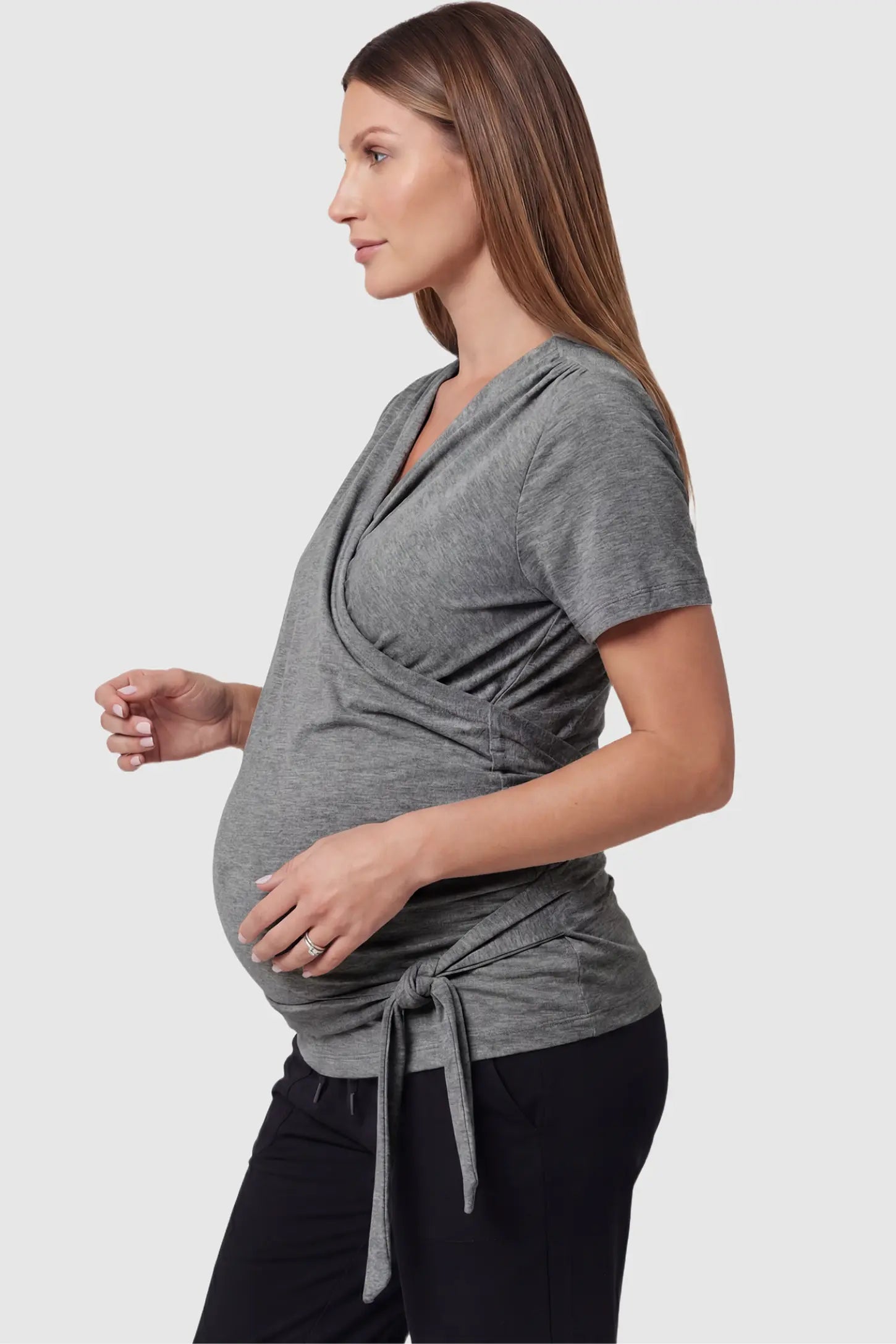 3 in 1 Skin to Skin Wrap Nursing Top Skin to Skin Wrap Nursing Top in gray featuring soft wrap-front design and short sleeves on pregnant model, side view
