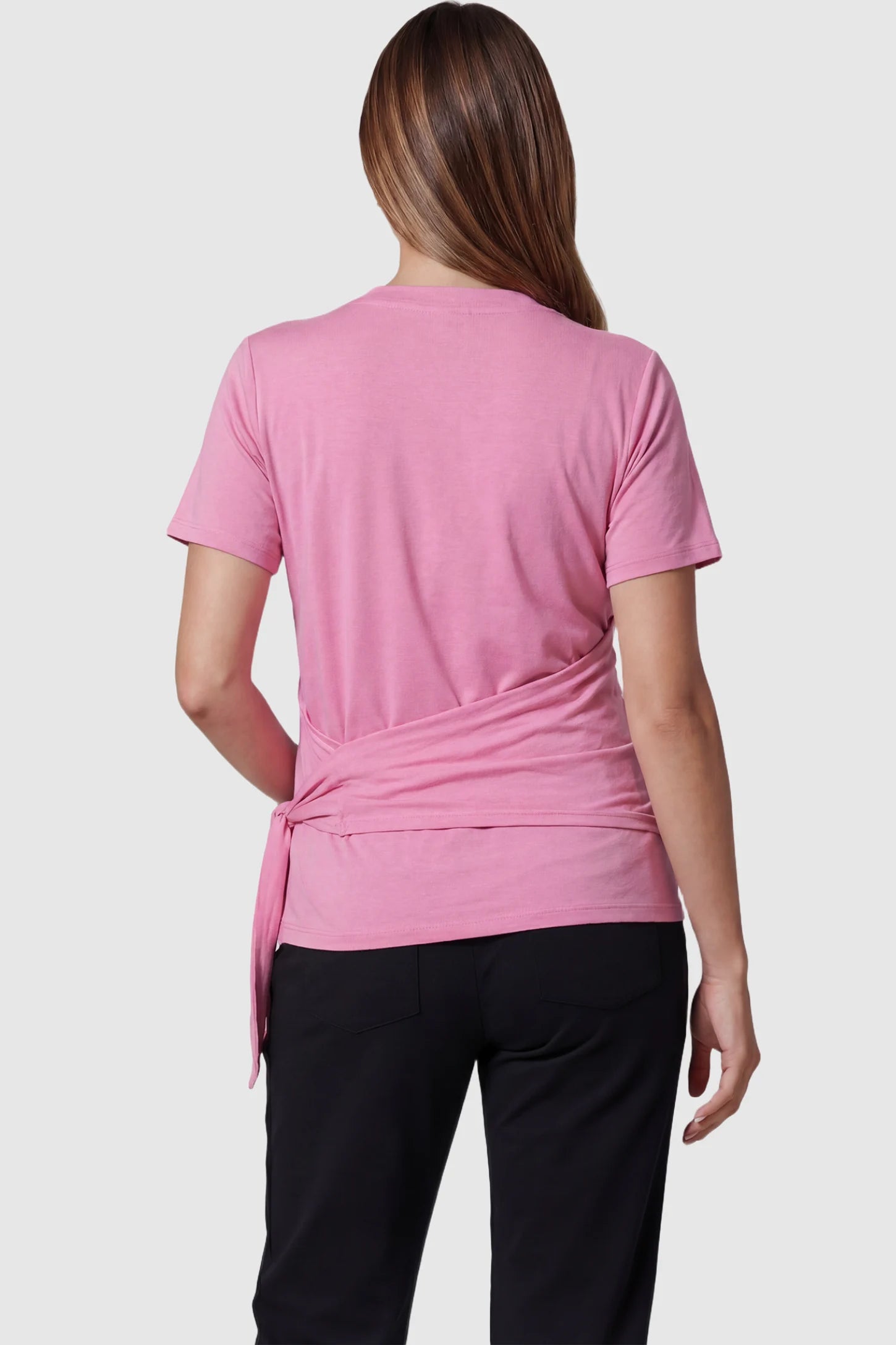 3 in 1 Skin to Skin Wrap Nursing Top Skin to Skin Wrap Nursing Top in pink featuring soft wrap-front design and short sleeves on pregnant model, back view.