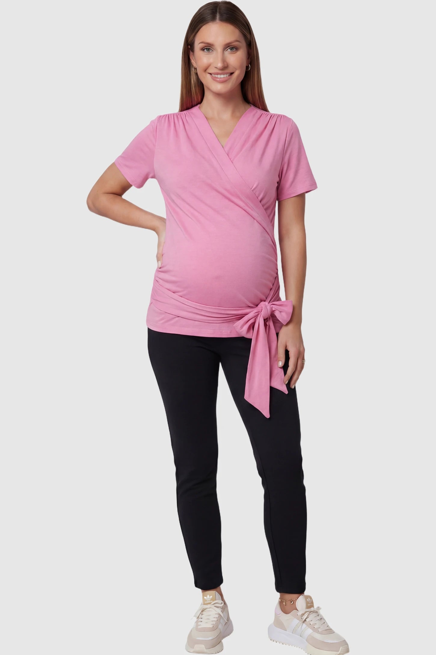 3 in 1 Skin to Skin Wrap Nursing Top Skin to Skin Wrap Nursing Top in pink featuring soft wrap-front design and short sleeves on pregnant model.