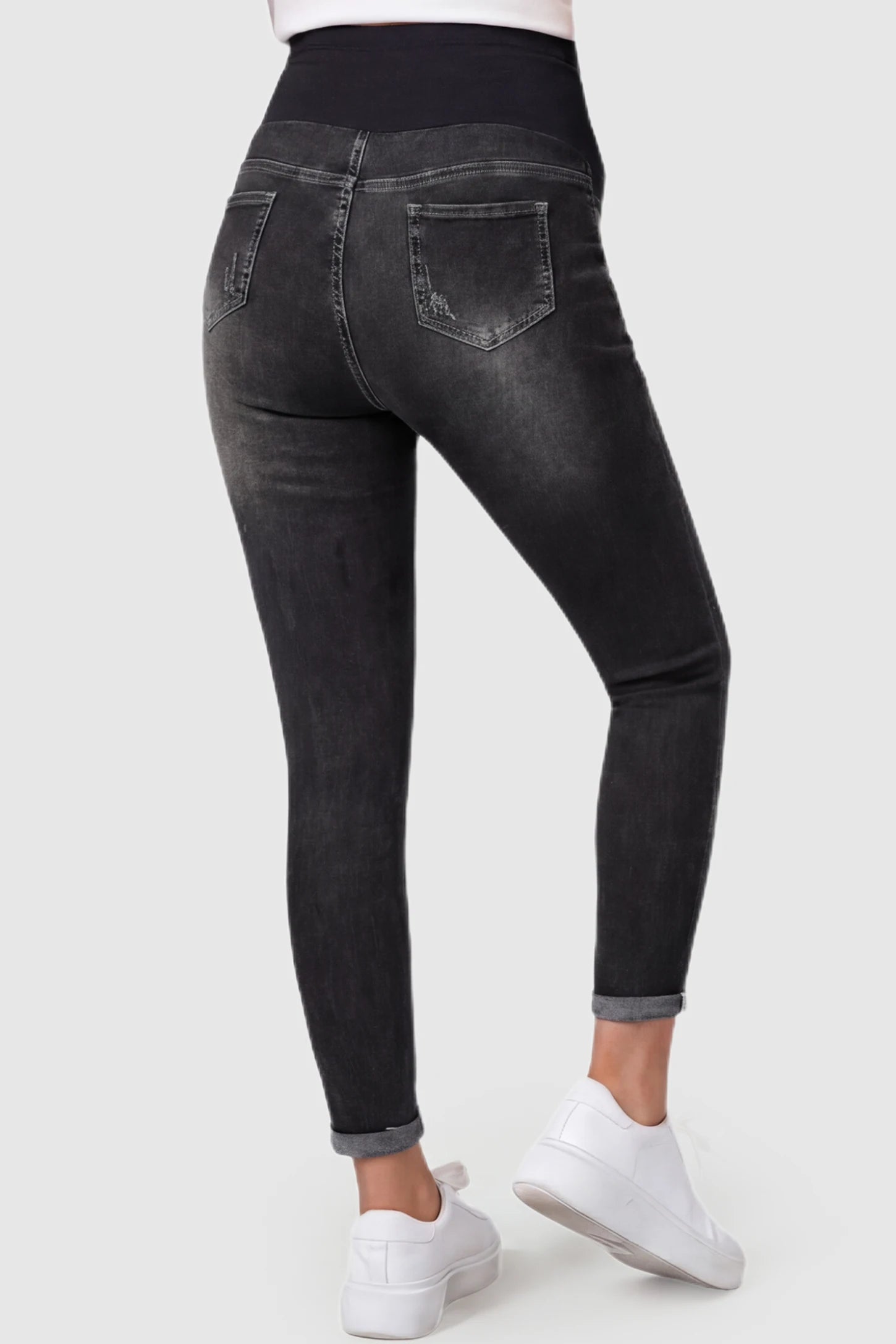 Cuffed Hem Skinny Maternity Jeans Cuffed Hem Skinny Maternity Jeans in black featuring back pockets and ankle-length cuffed hem on pregnant model.