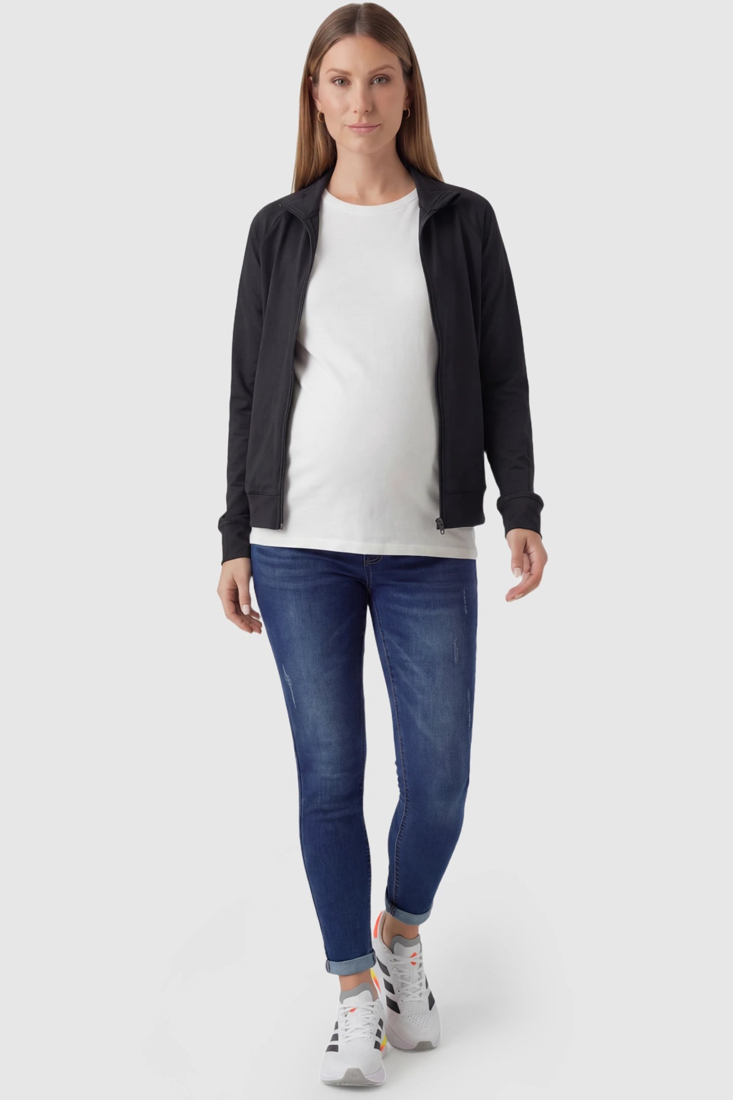 Cuffed Hem Skinny Maternity Jeans Cuffed Hem Skinny Maternity Jeans in dark blue featuring full belly panel and ankle-length cuffed hem on pregnant model.