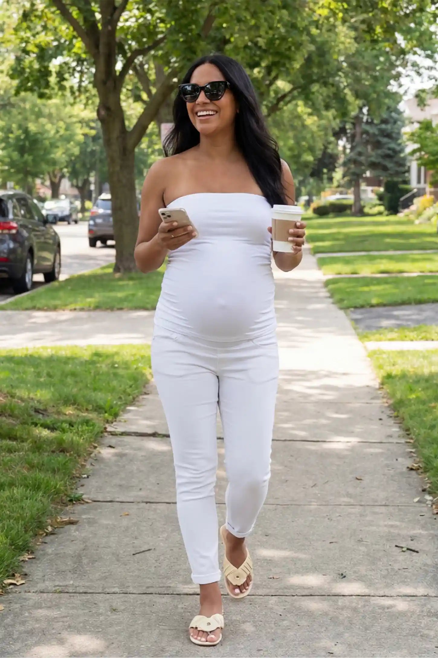 Cuffed Hem Skinny Maternity Jeans Cuffed Hem Skinny Maternity Jeans in White featuring full belly panel and ankle-length cuffed hem on front  view pregnant model.