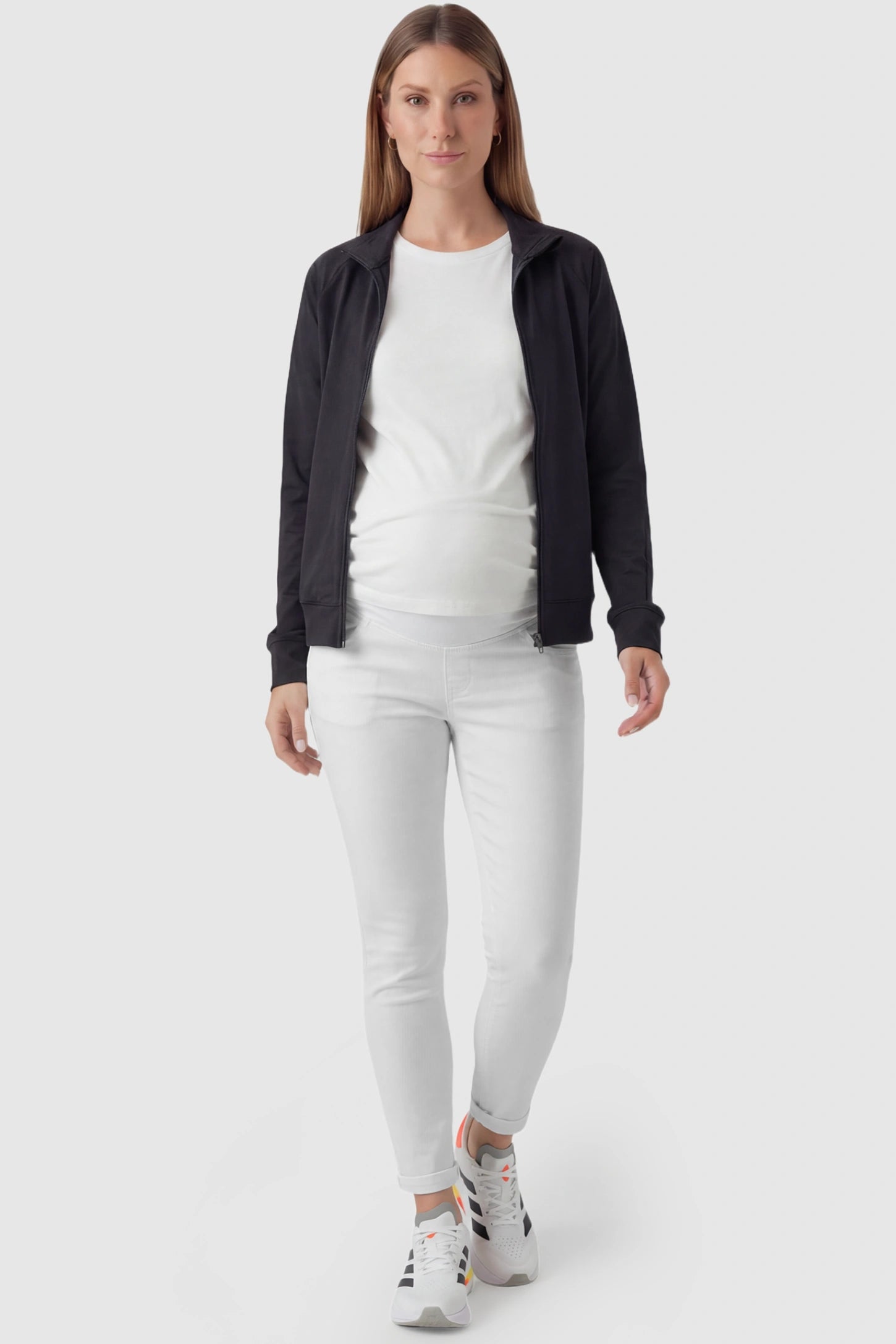 Cuffed Hem Skinny Maternity Jeans Cuffed Hem Skinny Maternity Jeans in White featuring full belly panel and ankle-length cuffed hem on pregnant model.