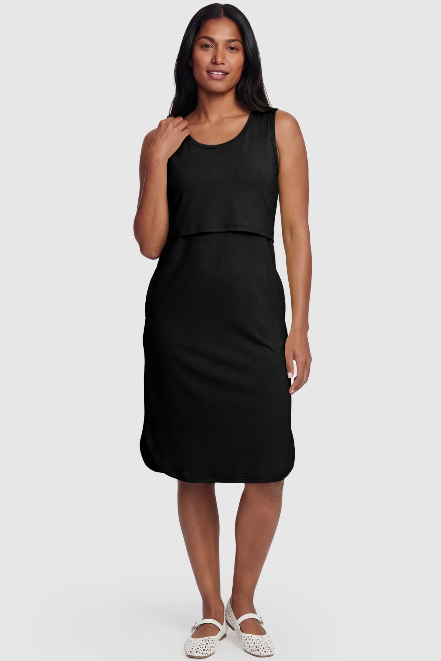 Sleeveless High-Waisted Midi Maternity & Nursing Dress Sleeveless high-waisted midi maternity and nursing dress in black featuring flattering empire silhouette in full body view on a postpartum model