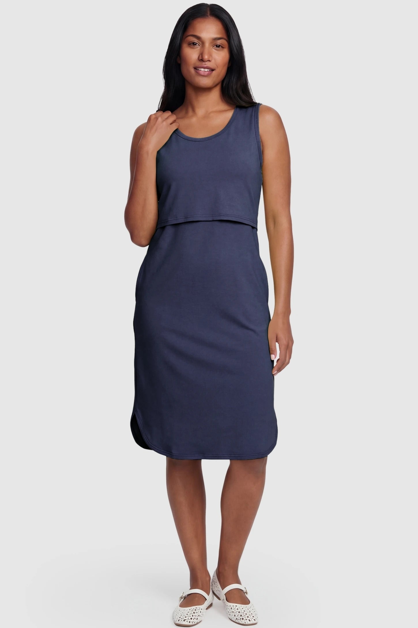 Sleeveless High-Waisted Midi Maternity & Nursing Dress Sleeveless high-waisted midi maternity and nursing dress in dark blue featuring flattering empire silhouette in full body view on a postpartum model