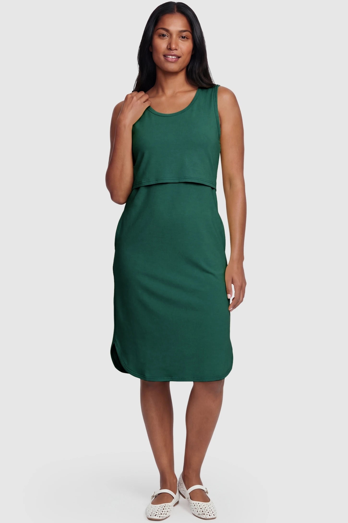 Sleeveless High-Waisted Midi Maternity & Nursing Dress Sleeveless high-waisted midi maternity and nursing dress in green featuring flattering empire silhouette in full body view on a postpartum model