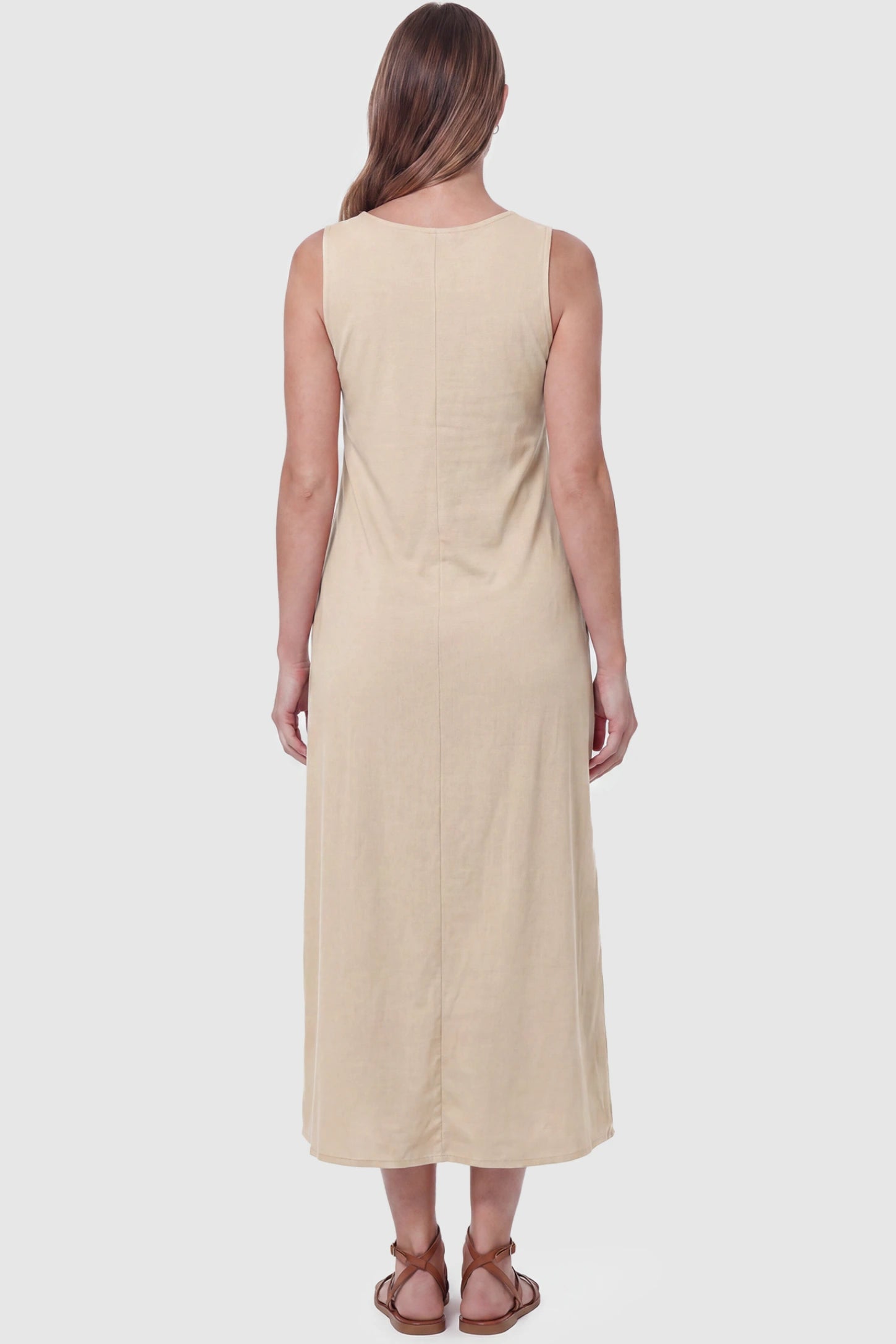 Sleeveless Pocketed Longline Hem Maternity Midi Dress Sleeveless pocketed longline hem maternity midi dress in khaki with sleeveless design and longline hem, back view on pregnant model