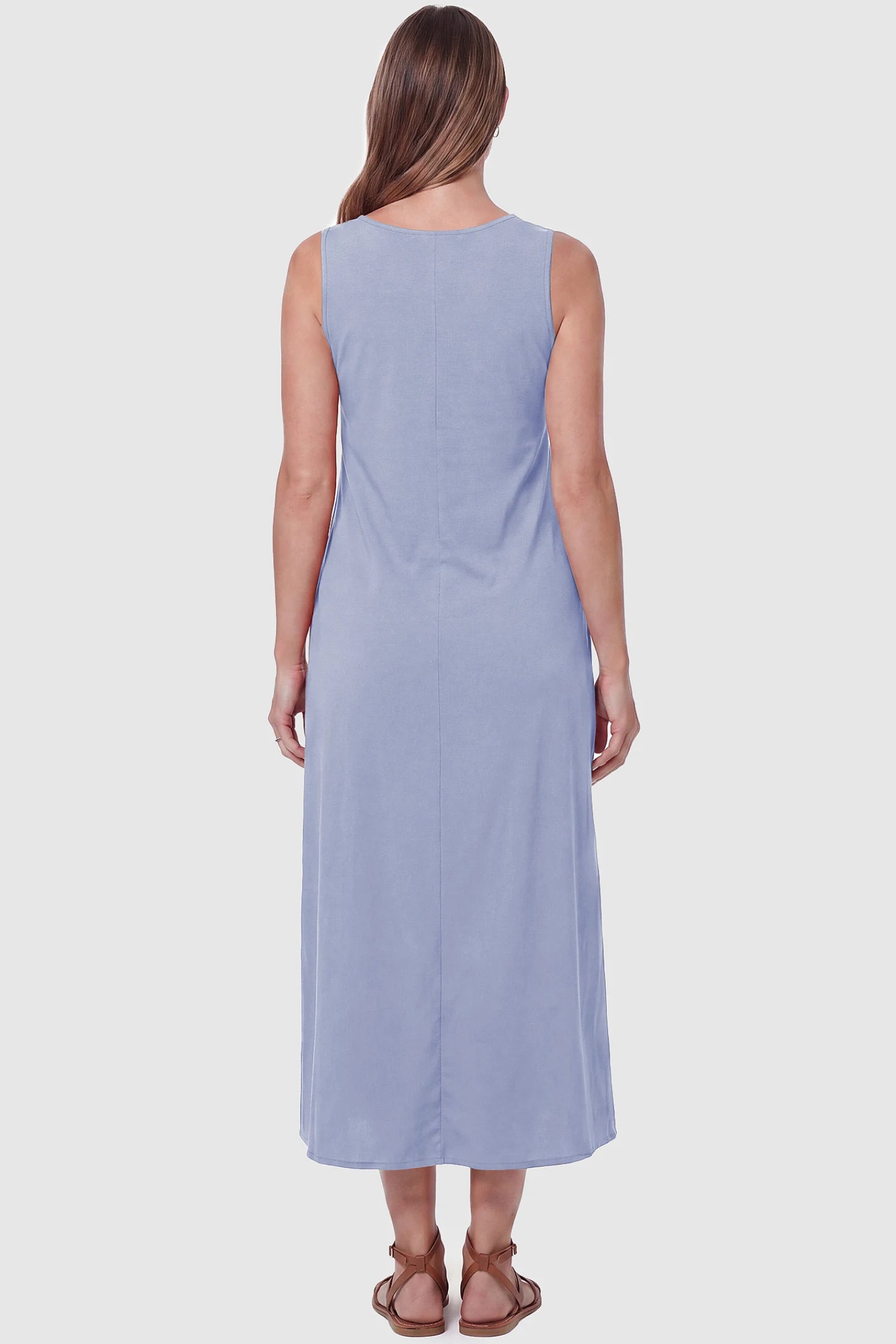 Sleeveless Pocketed Longline Hem Maternity Midi Dress Sleeveless pocketed longline hem maternity midi dress in light blue with sleeveless design and longline hem, back view on pregnant model