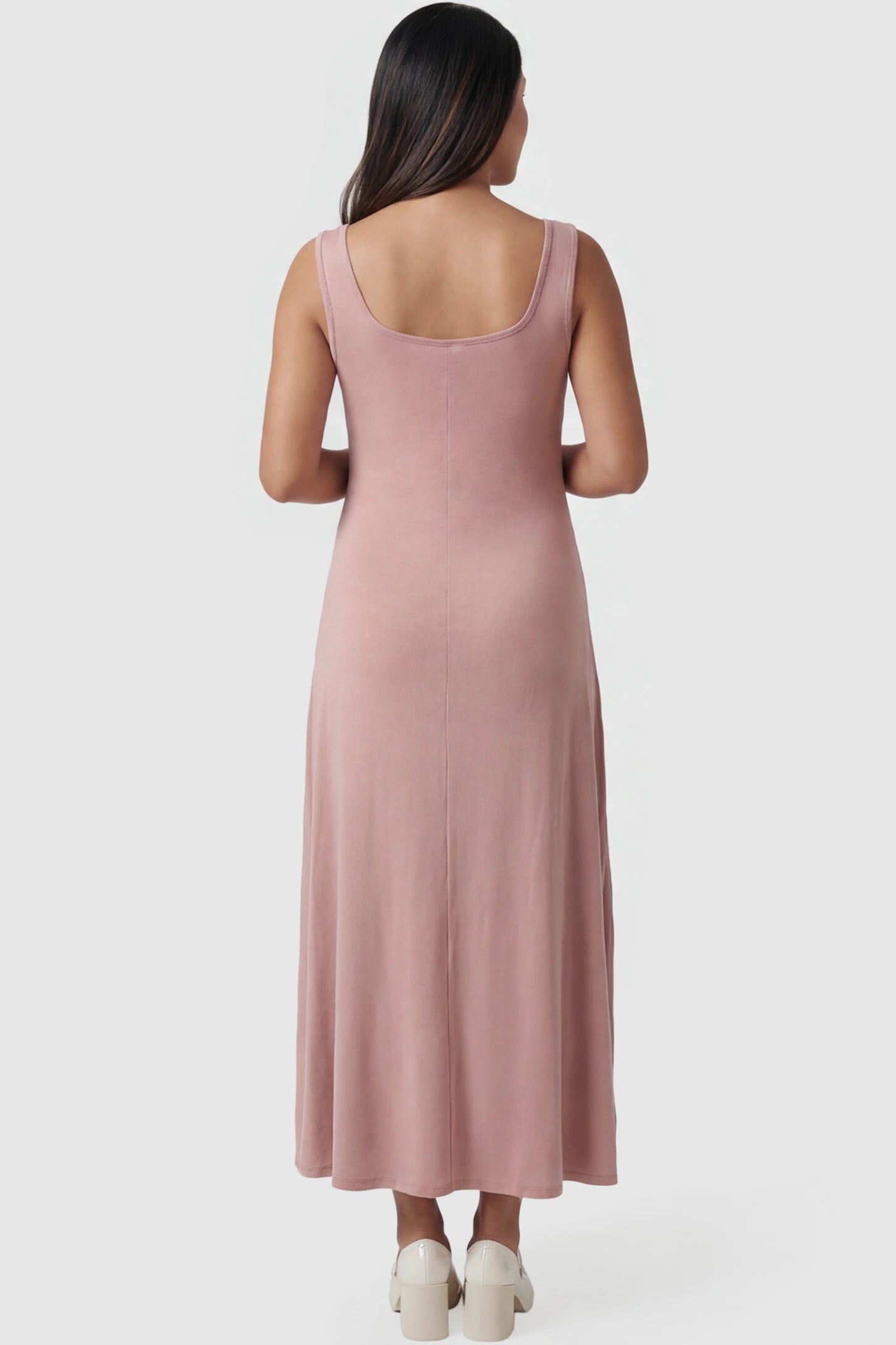 Square Neck Sleeveless Maternity Maxi Dress Square neck sleeveless maternity maxi dress in pink with sleeveless design, back view on pregnant model