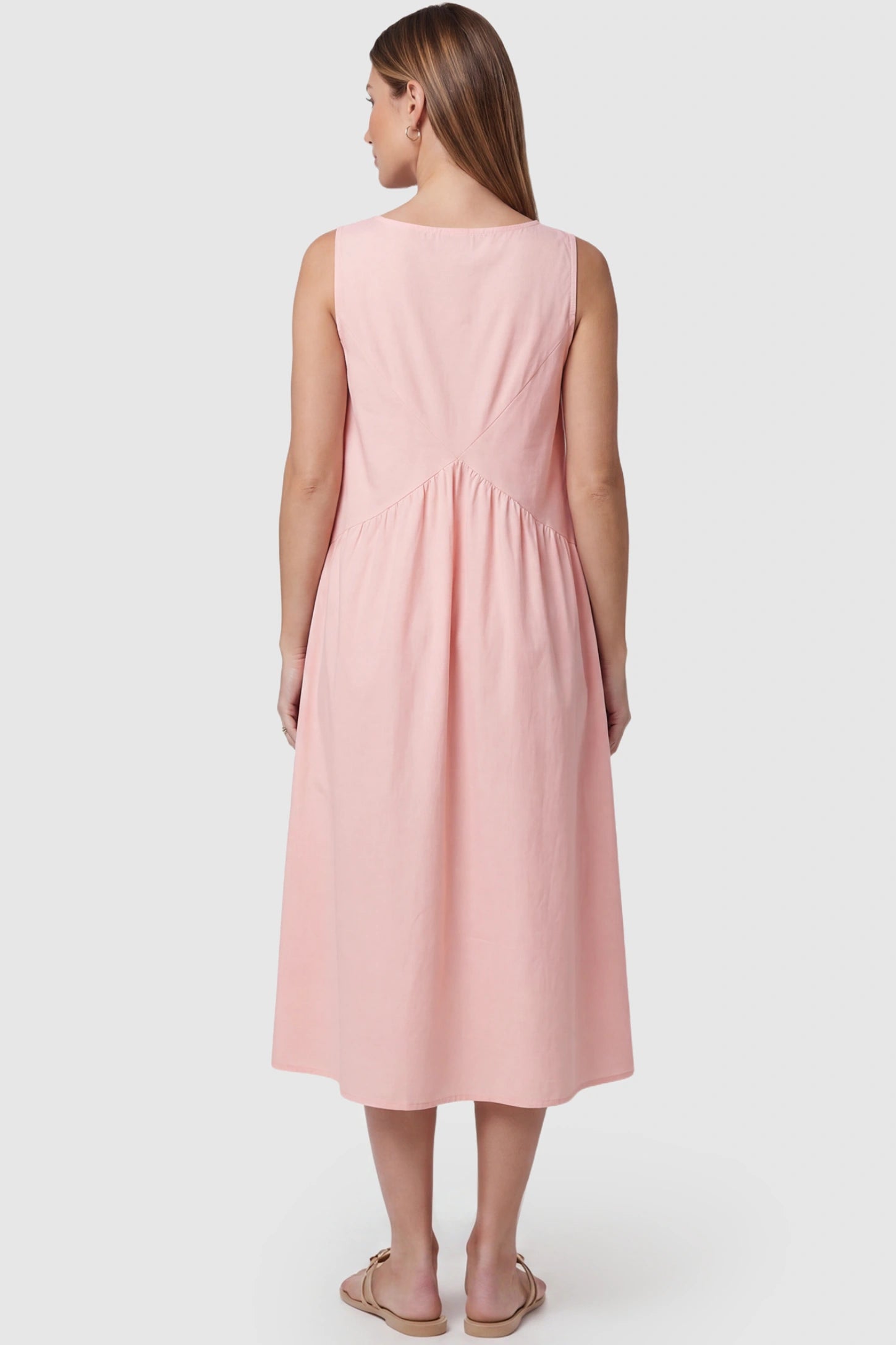 Sleeveless A-Line Maternity Midi Dress with Pockets Sleeveless A-line maternity midi dress with pockets in pink with sleeveless design and soft drape, back view on pregnant model