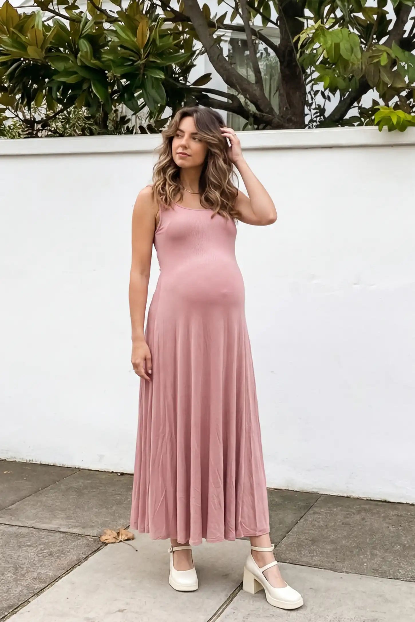 Square Neck Sleeveless Maternity Maxi Dress Square neck sleeveless maternity maxi dress in pink with sleeveless design, front view on pregnant model